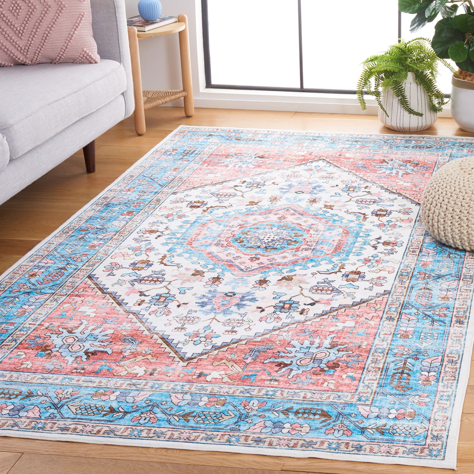 Vibrant medallion rug brightens the space with turquoise and coral tones and a traditional border || WPR322K-5 || front_angle_room