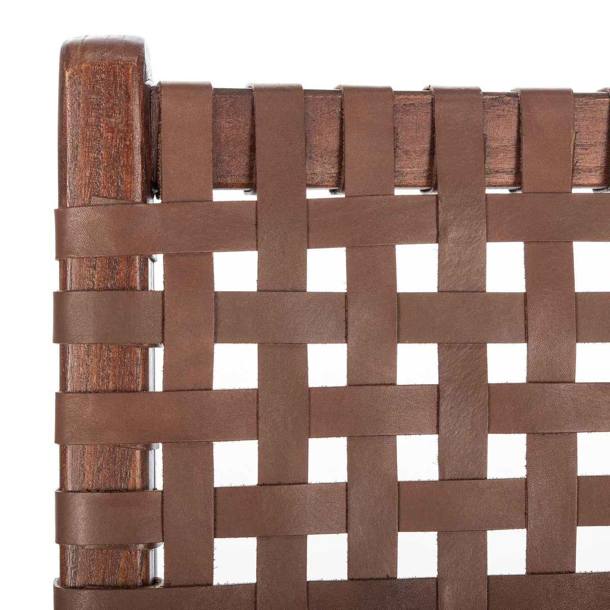 Cognac leather bands interlace over a warm wood rail for a richly textured finish.