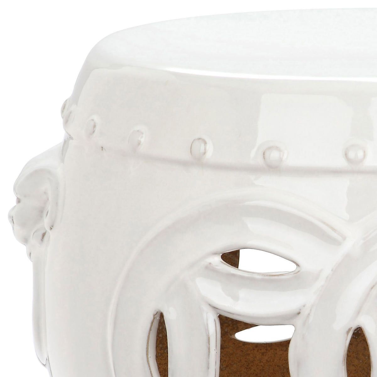 Smooth antique white glaze finishes the raised beaded trim and layered openwork coin details.