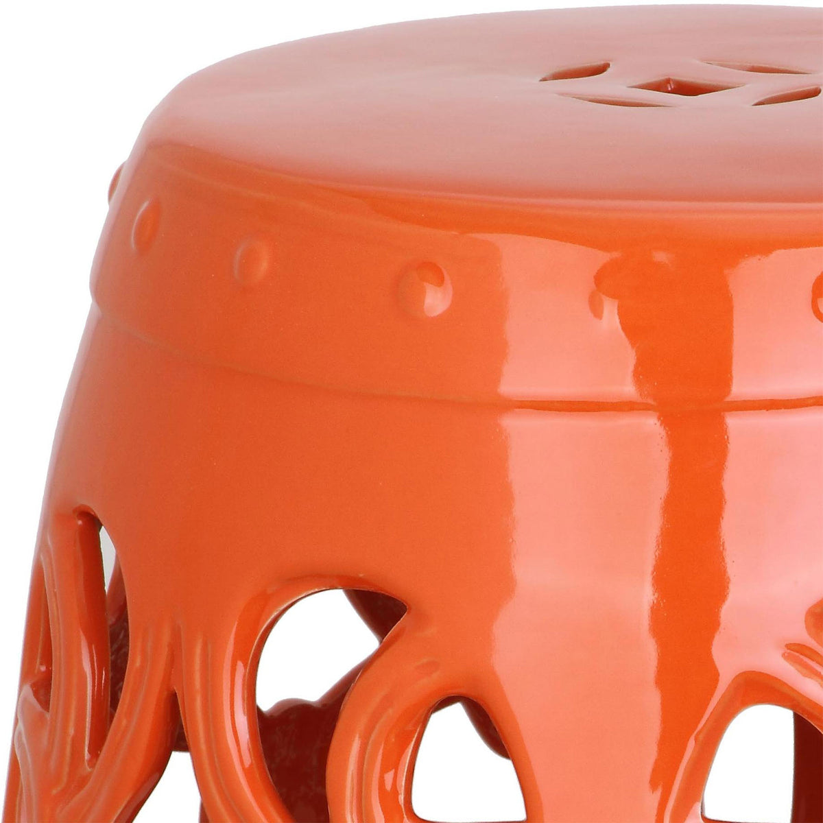 Glossy orange ceramic features a dotted rim and flowing vine cutouts || ACS4539D || detail_studio