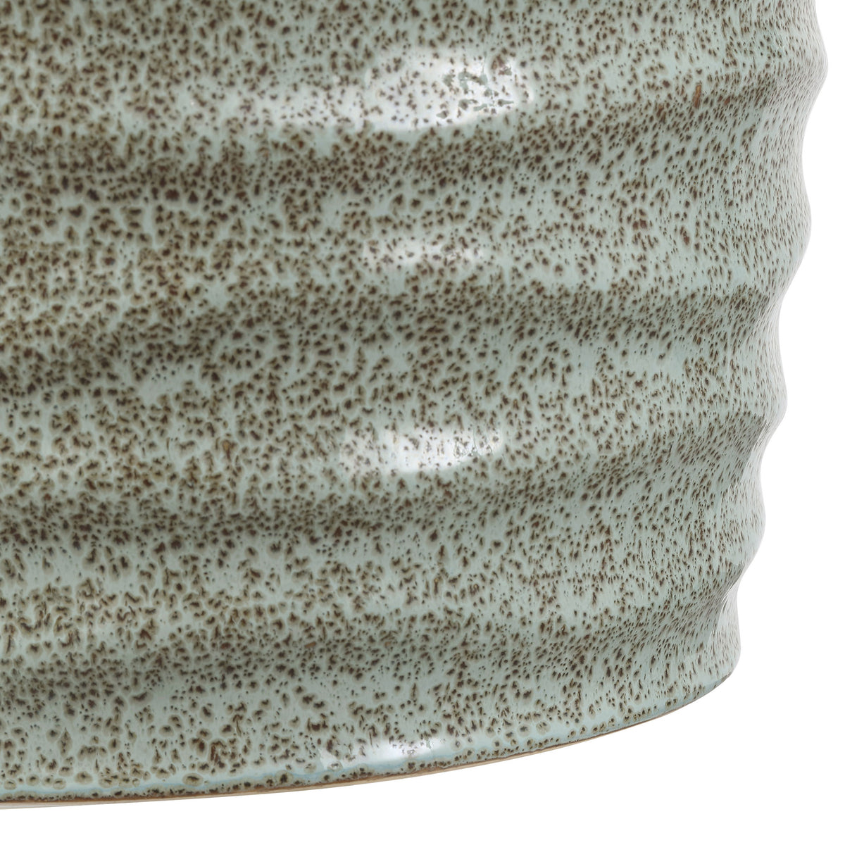 Dense brown speckles and gentle ribbing give the pale blue ceramic a textured look near the base. || ACS4575B || detail_studio