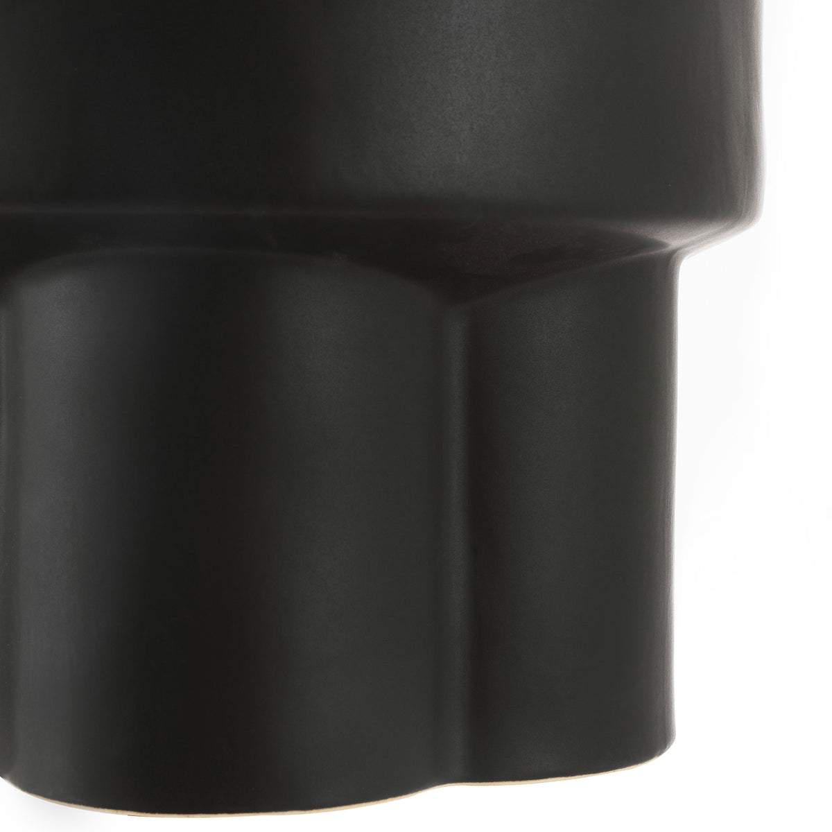 Scalloped pedestal base adds sculptural detail to the matte black ceramic stool || ACS4593A || leg_studio
