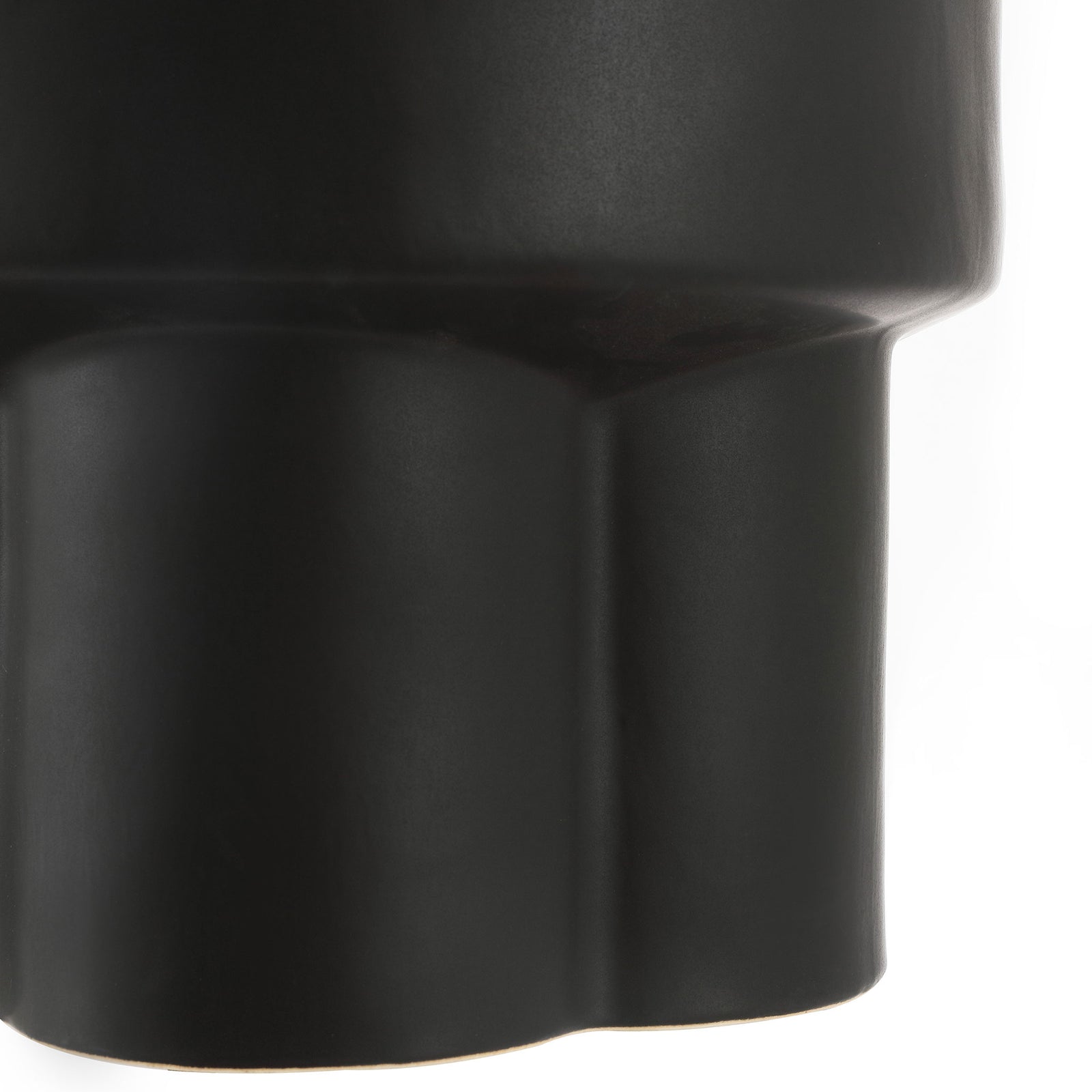 Scalloped pedestal base adds sculptural detail to the matte black ceramic stool || ACS4593A || leg_studio
