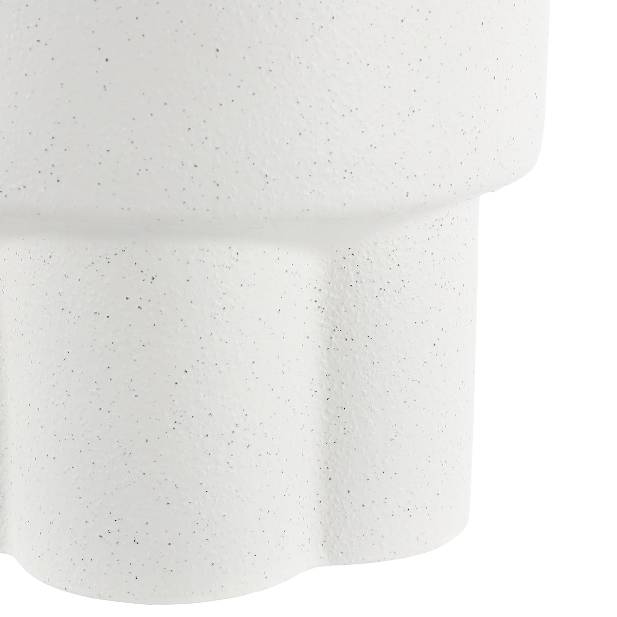 Fluted ceramic pedestal carries the stool's delicate white speckled finish