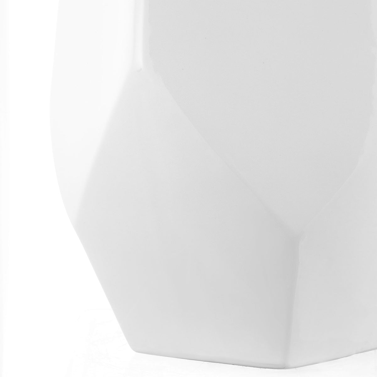 Sculpted lower sides narrow toward the white ceramic stool's sturdy base || ACS4596A || leg_studio