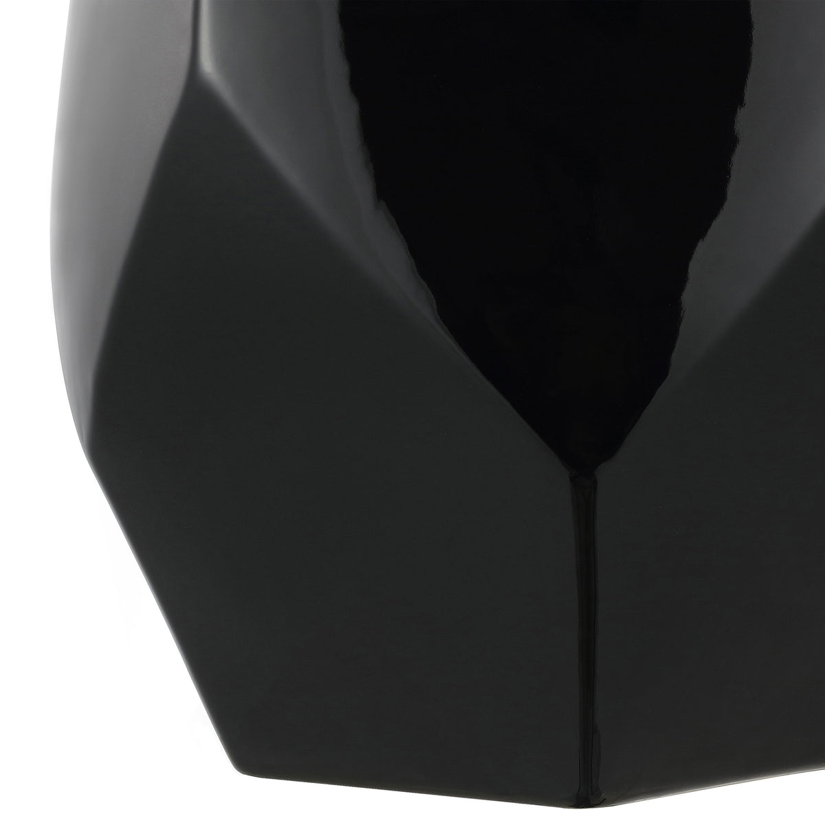Angular lower facets taper to a compact base in rich black ceramic || ACS4596B || leg_studio