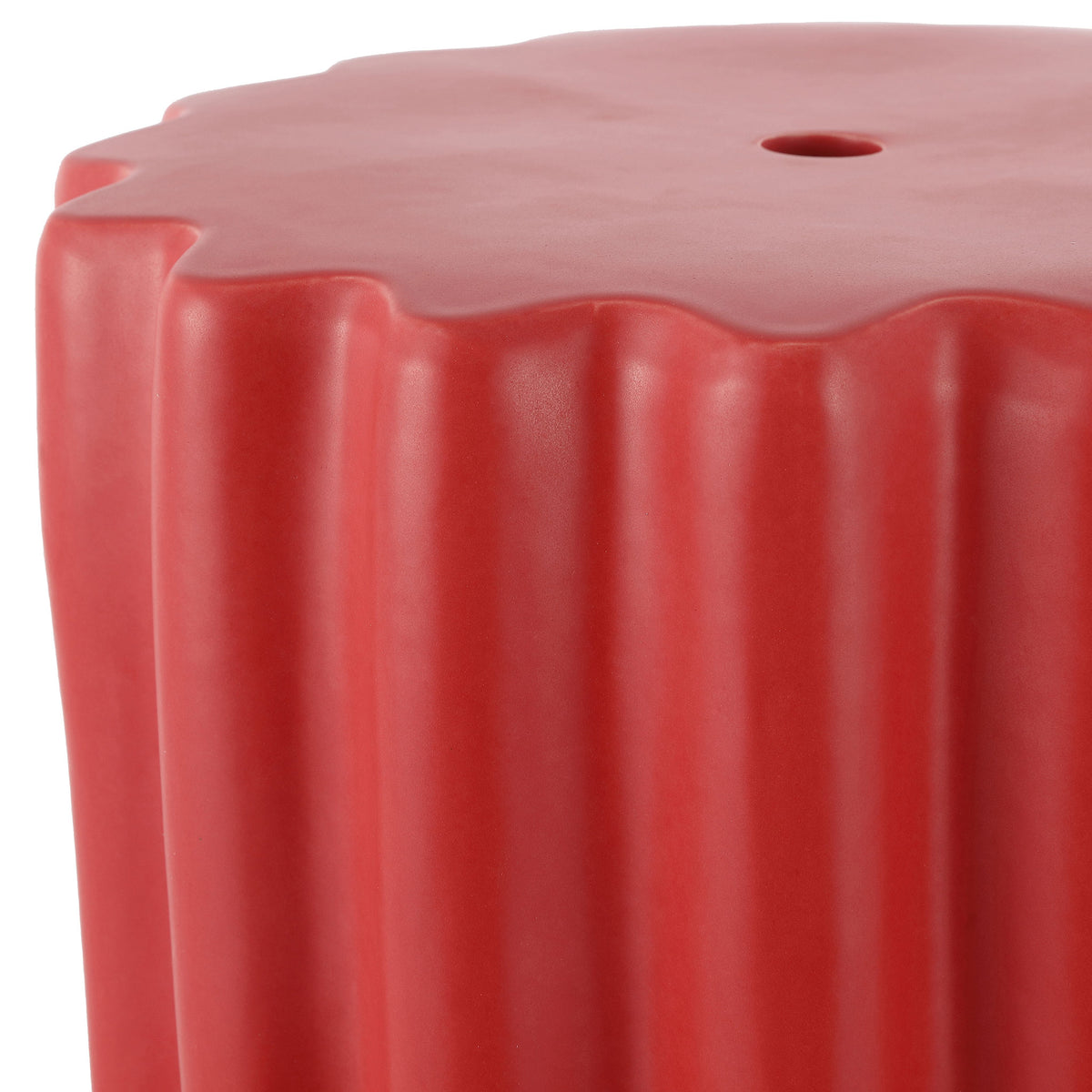 Vibrant red ceramic pairs a softly scalloped top with sculptural vertical fluting