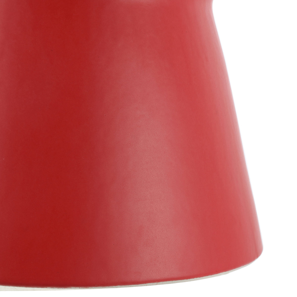 A flared base gives the bright red ceramic stool its sculptural silhouette.