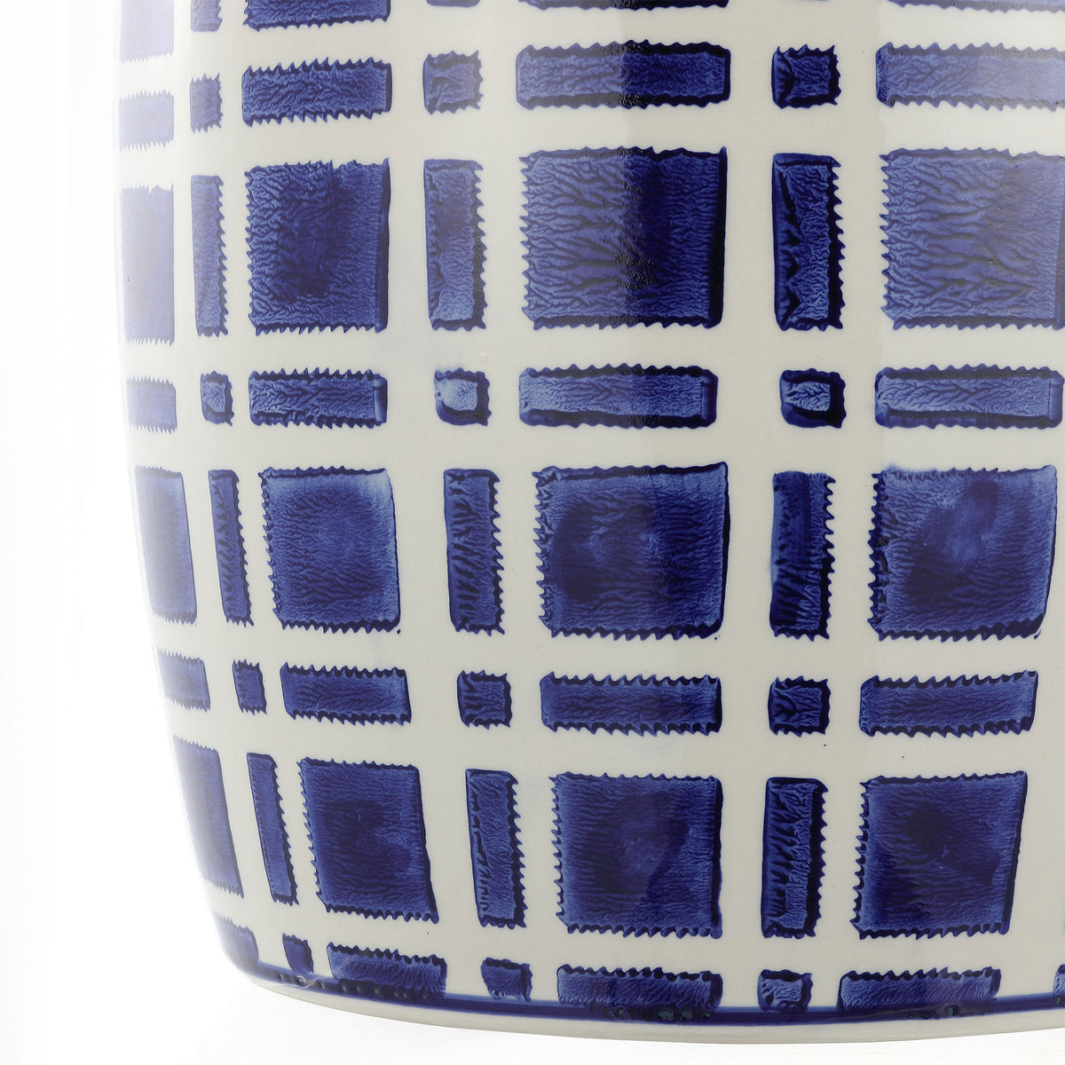 Deep navy blocks and crisp white lines give the curved ceramic stool a bold geometric look || ACS4602A || detail_studio
