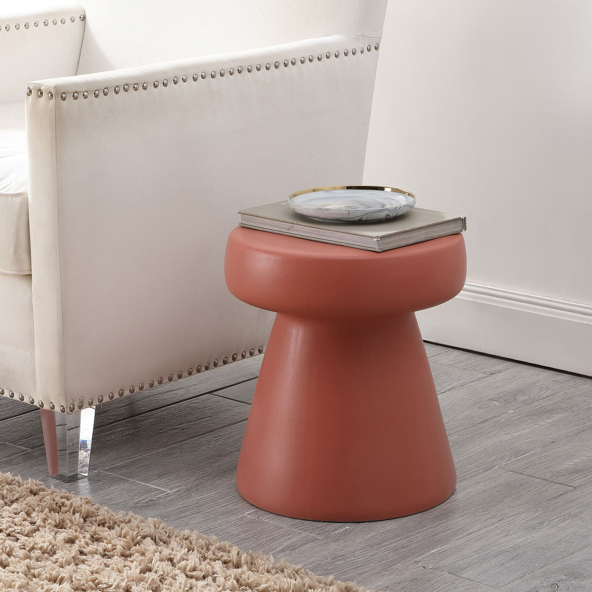 Warm terracotta ceramic stool adds a handy side-table surface beside a neutral chair || ACS4603C || front_angle_room