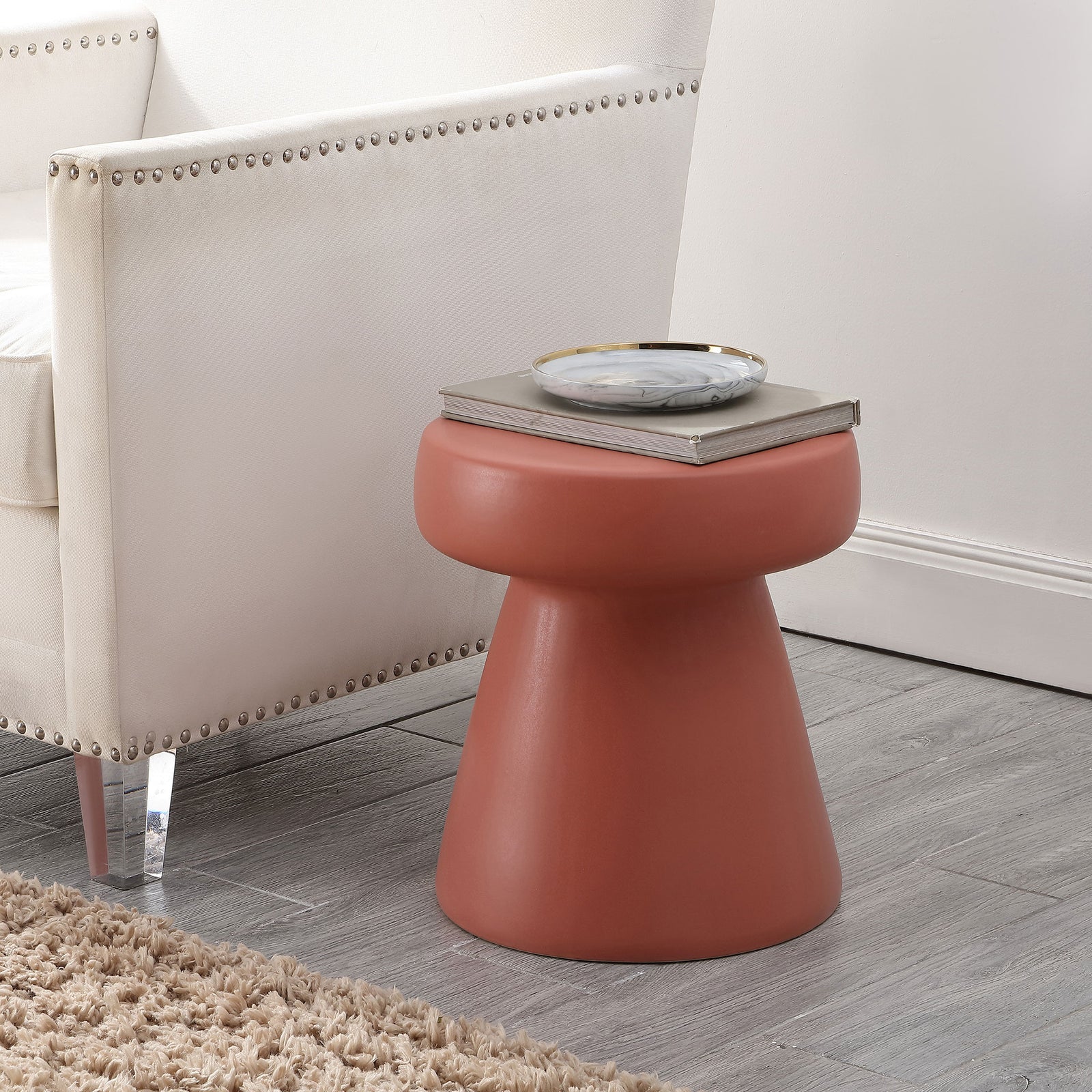 Warm terracotta ceramic stool adds a handy side-table surface beside a neutral chair || ACS4603C || front_angle_room