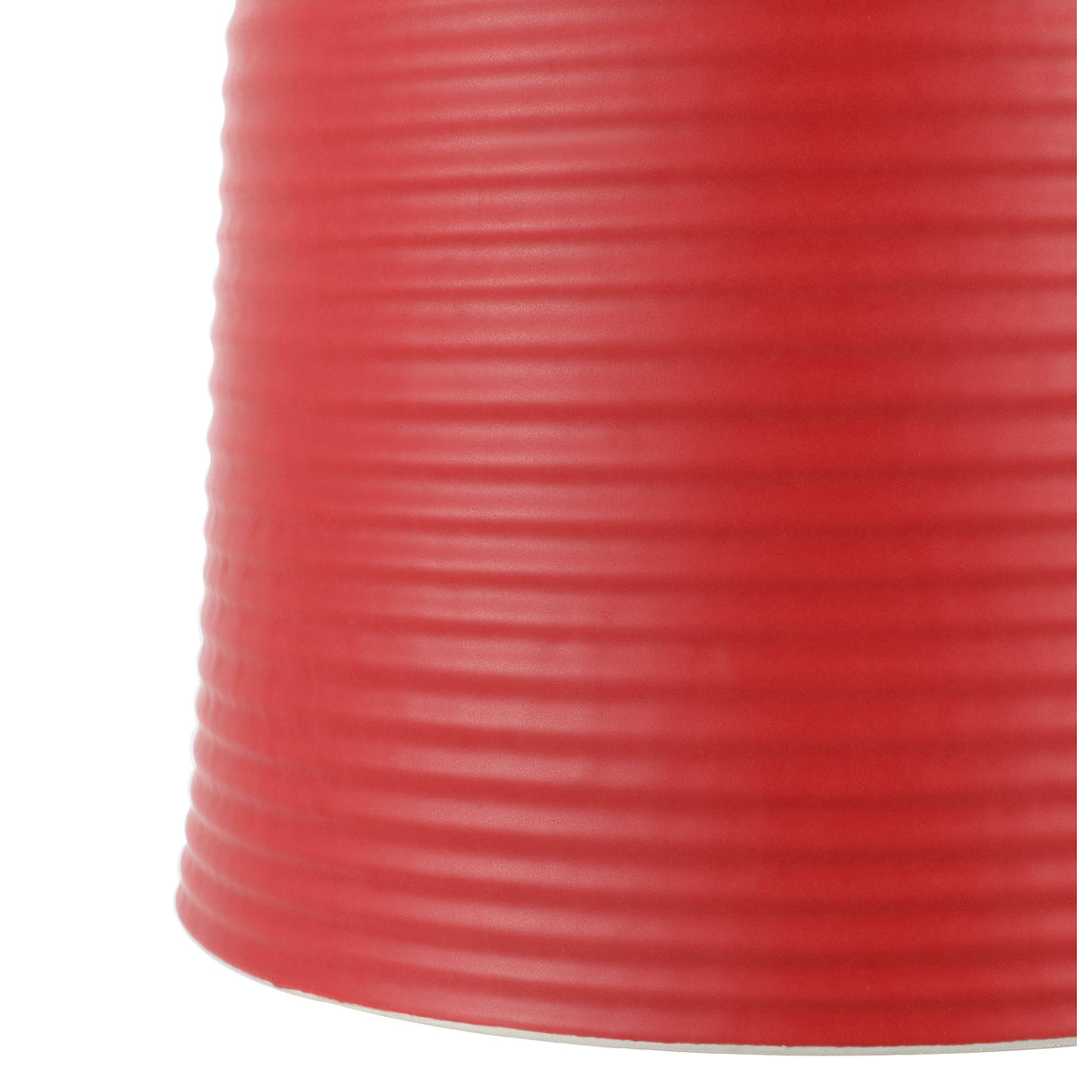 Bright red ceramic base widens gently toward its lower edge, with fine horizontal ridges