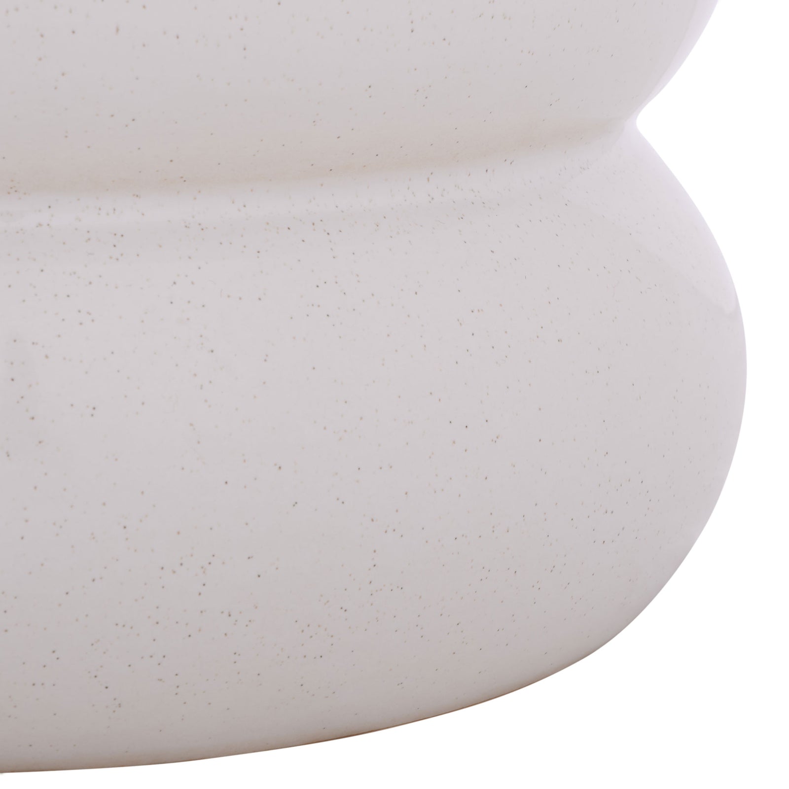 The rounded base has a soft cream finish dotted with delicate speckles. || ACS4608B || leg_studio