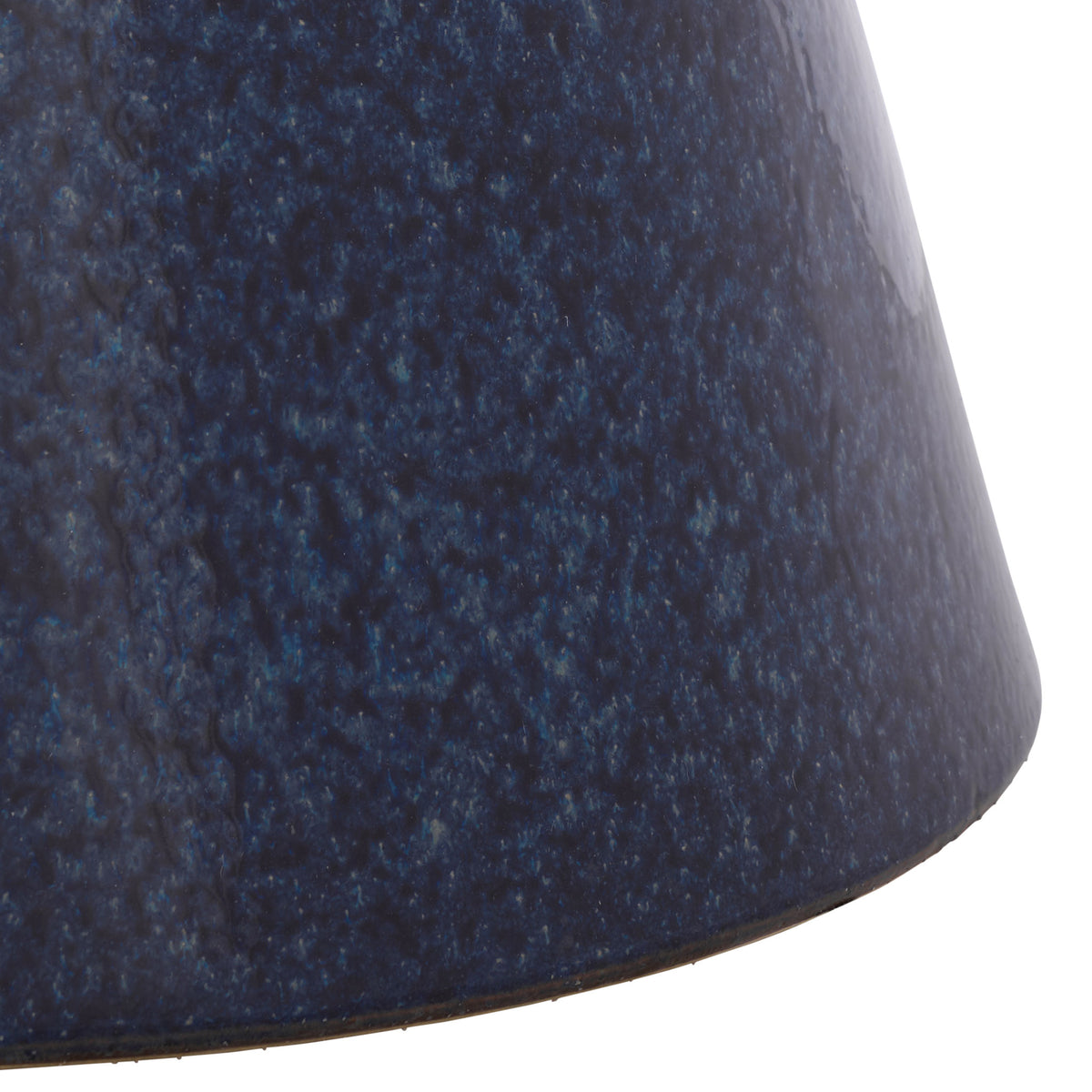 A flared pedestal base brings sculptural balance to the textured blue ceramic stool. || ACS4611B || leg_studio