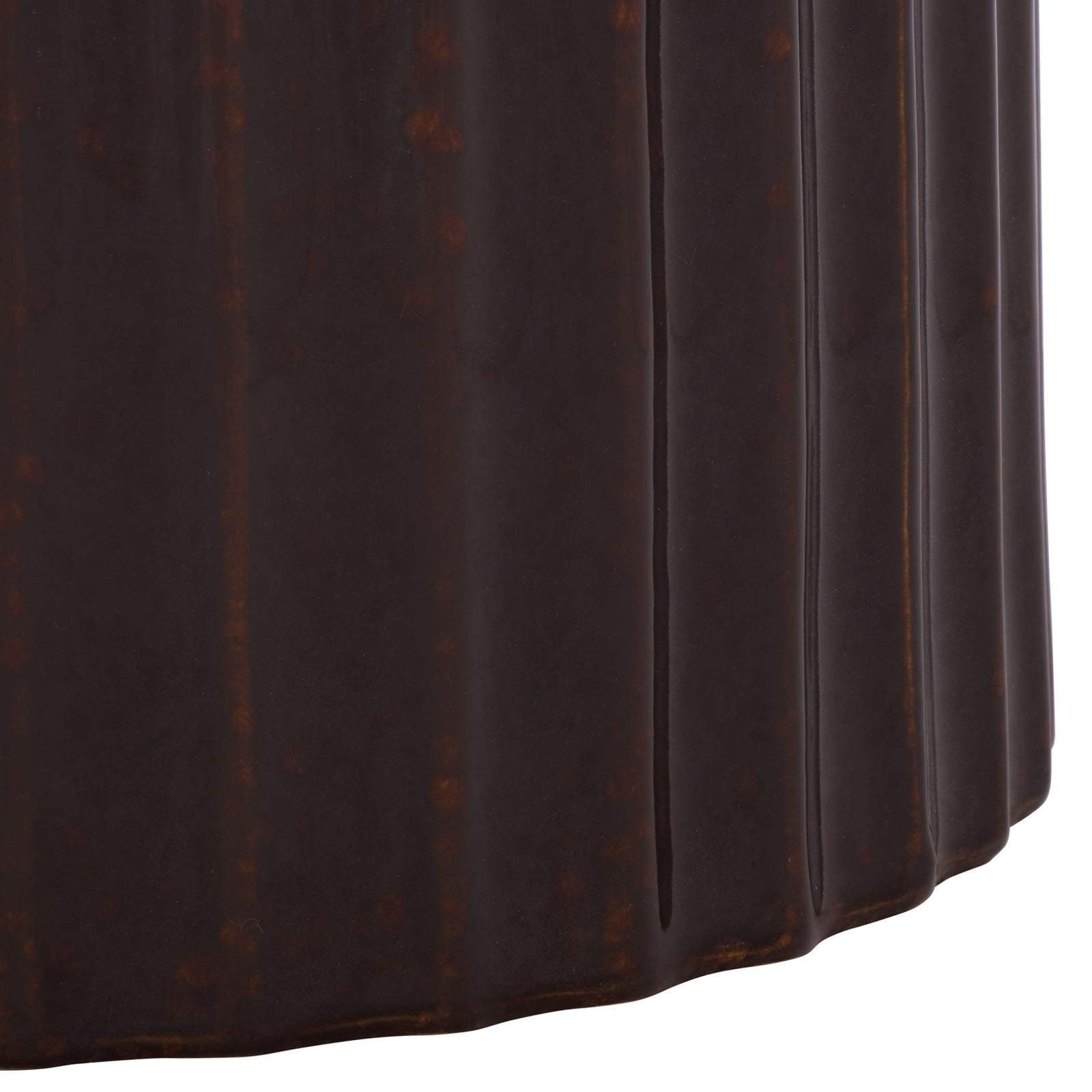 Deep vertical fluting and a scalloped base give the brown ceramic stool a sculptural finish. || ACS4613A || leg_studio