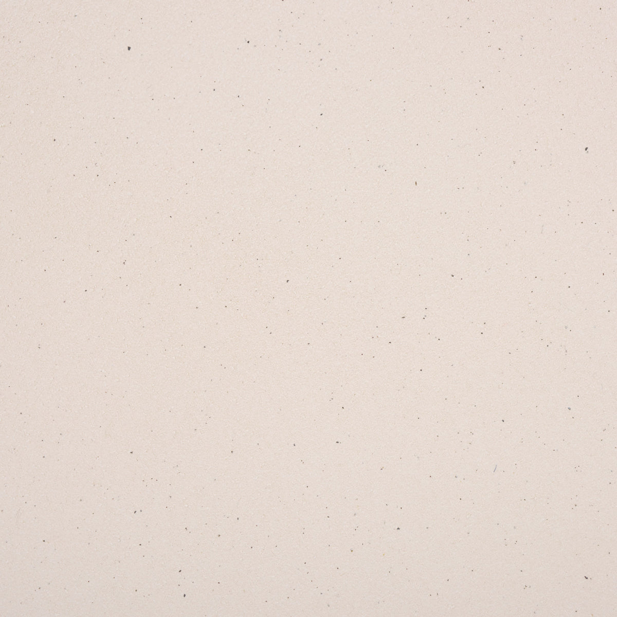 Subtle dark speckles add visual texture to the light cream ceramic finish. || ACS4614A || swatch_studio