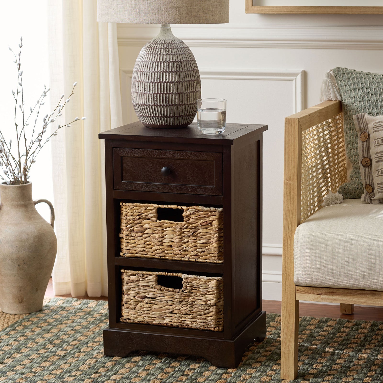 A dark brown side table blends convenient basket storage with a warm, timeless finish. || AMH5700H || front_angle_room