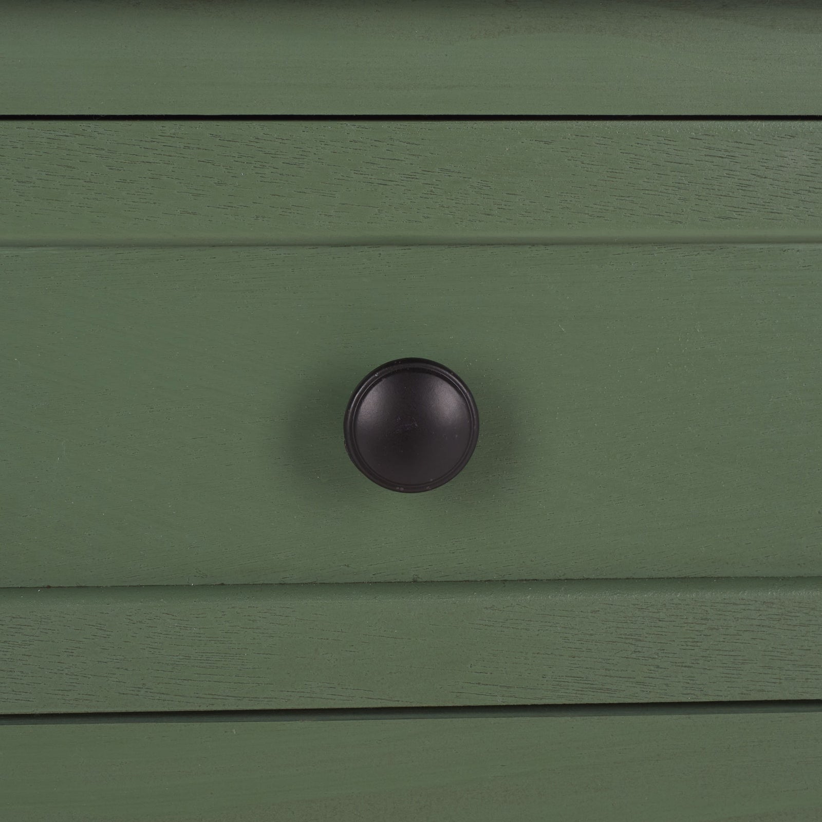 A dark round knob contrasts with the dusty green drawer and its subtle wood grain. || AMH5700L || handle_studio