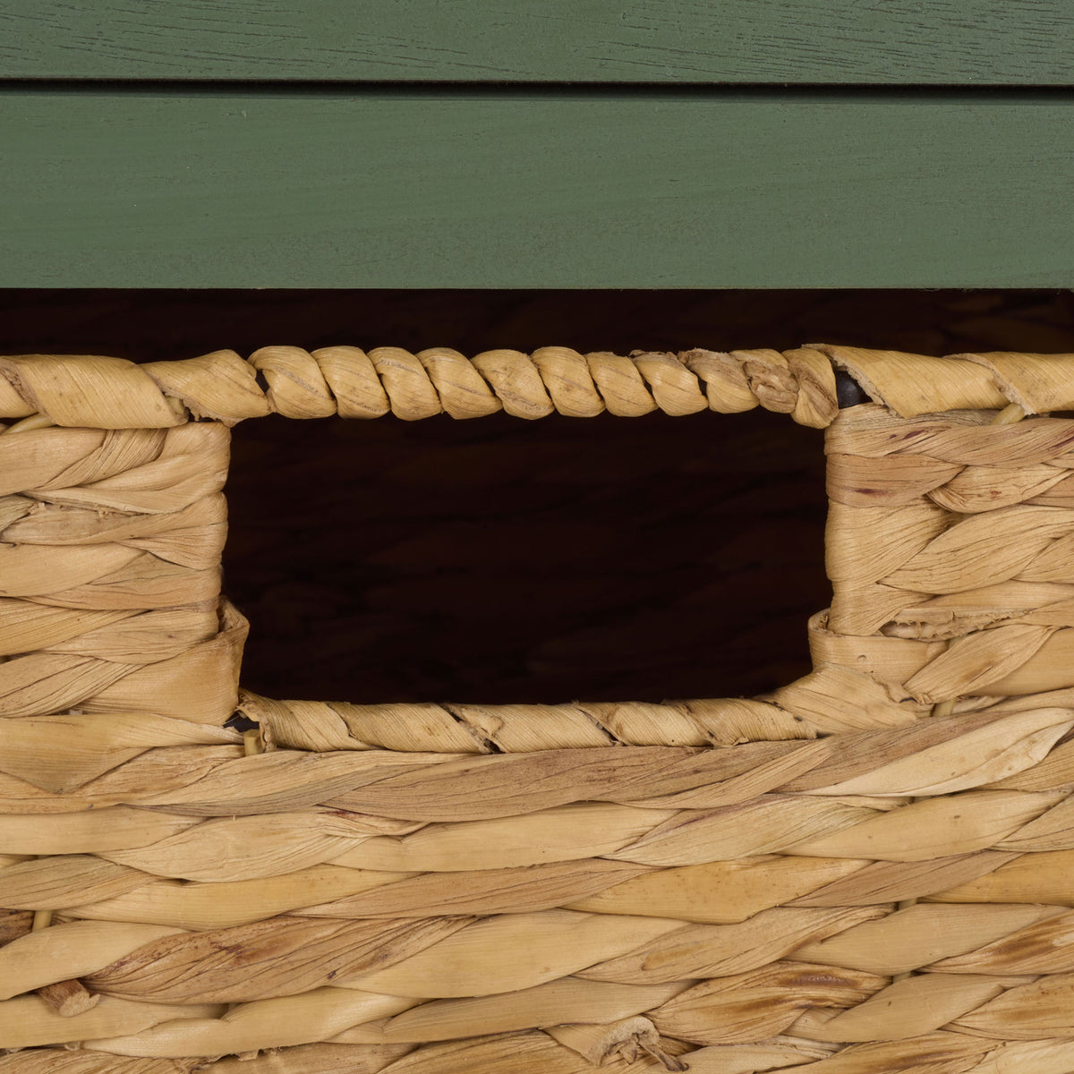 A natural woven basket adds warmth and a built-in handhold to the dusty green frame. || AMH5700L || handle_studio