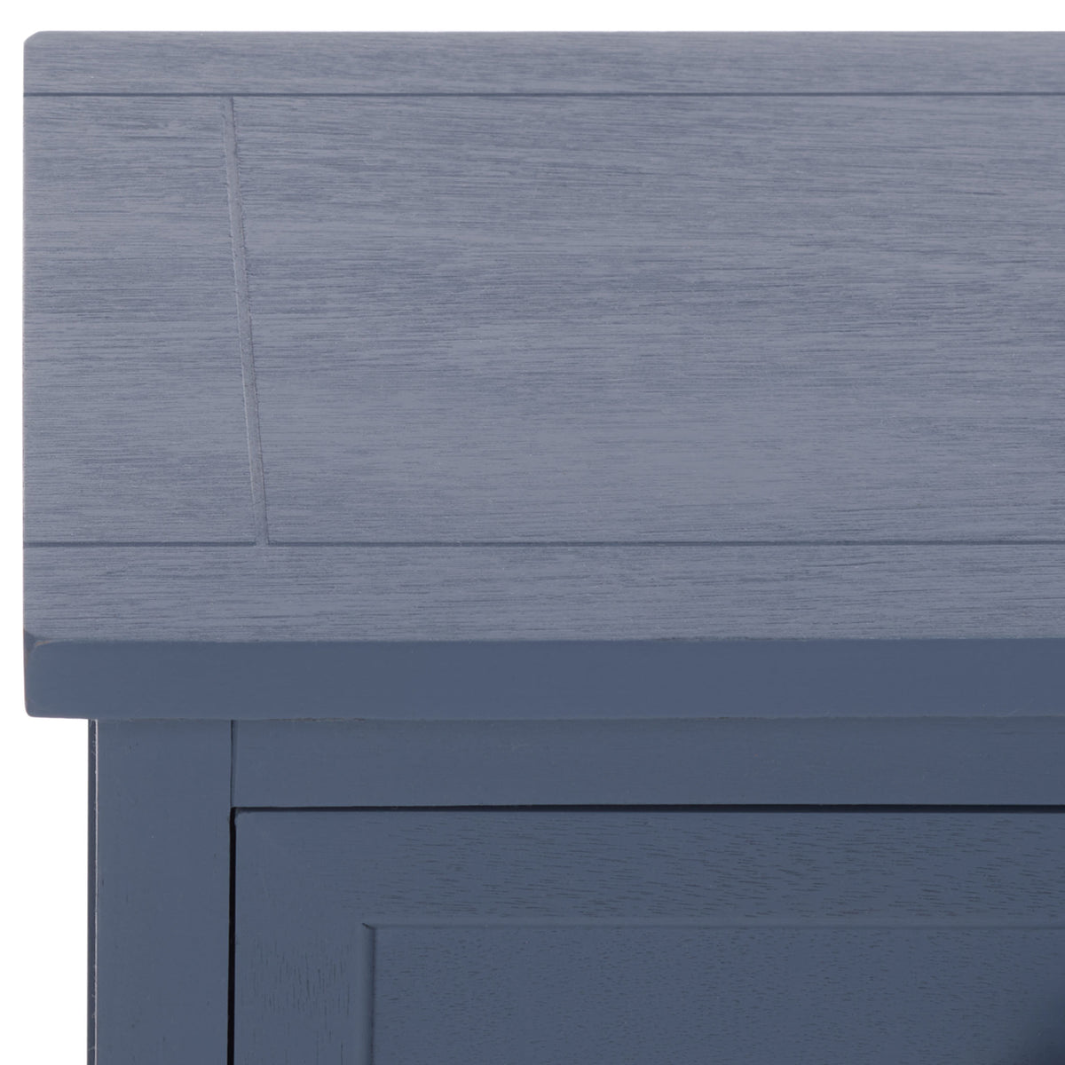 A subtly paneled tabletop and blue painted wood grain add understated texture.