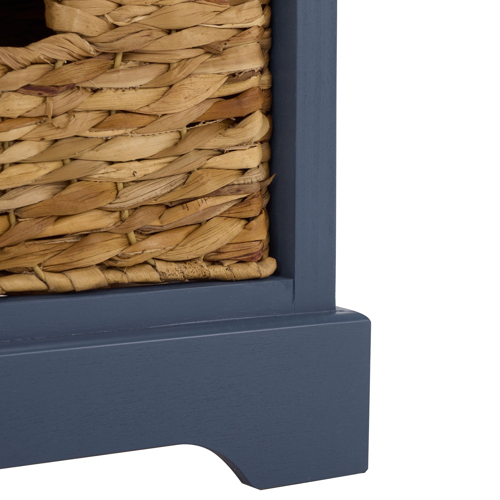 A sculpted blue base supports the cabinet beneath its woven basket compartments. || AMH5702K || leg_studio
