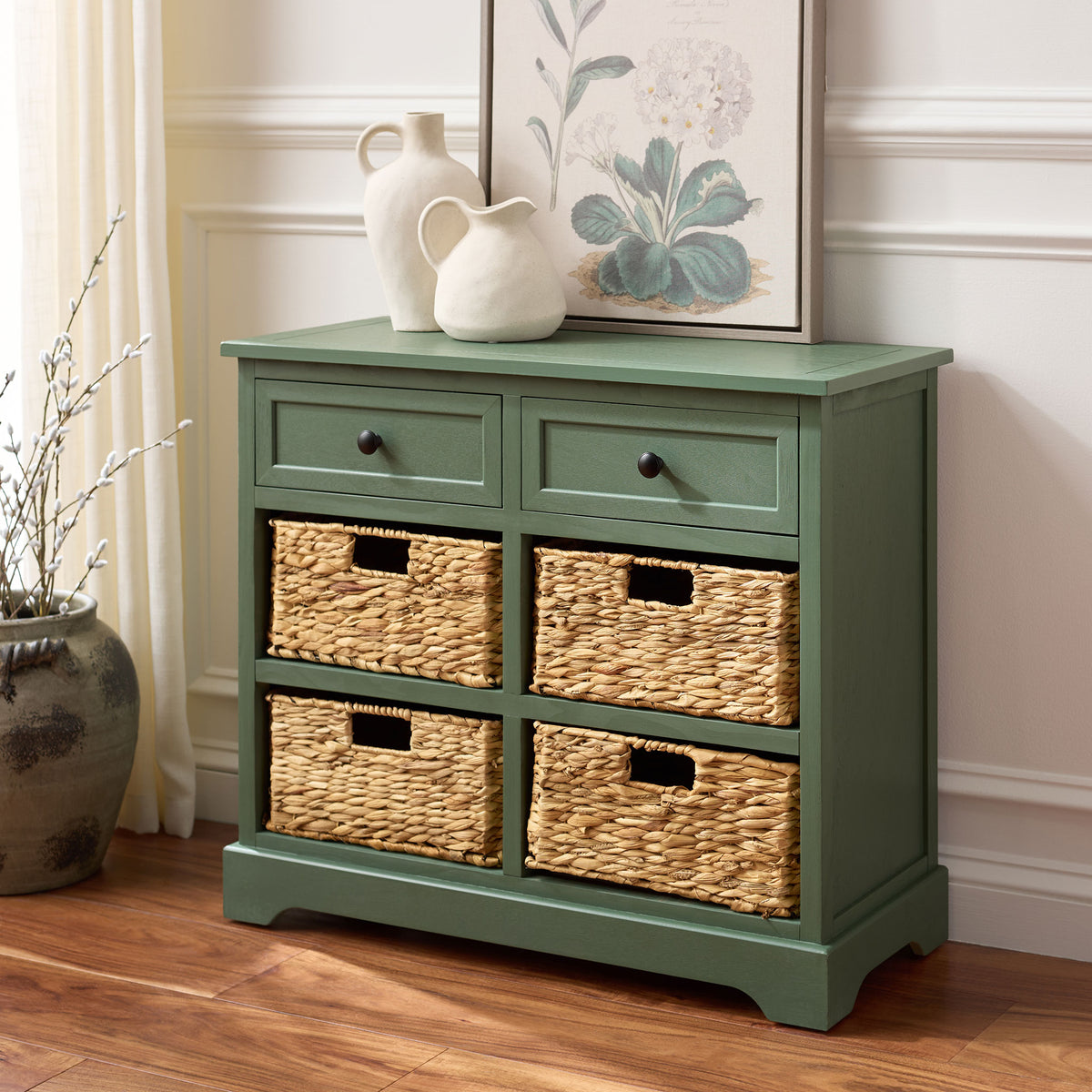 Dusty green storage brings four woven baskets and two handy drawers into the room. || AMH5702L || front_angle_room