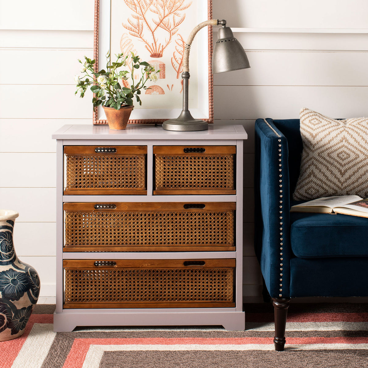 A softly painted gray cabinet offers four amber cane drawers and a spacious top for display. || AMH6504C || front_room