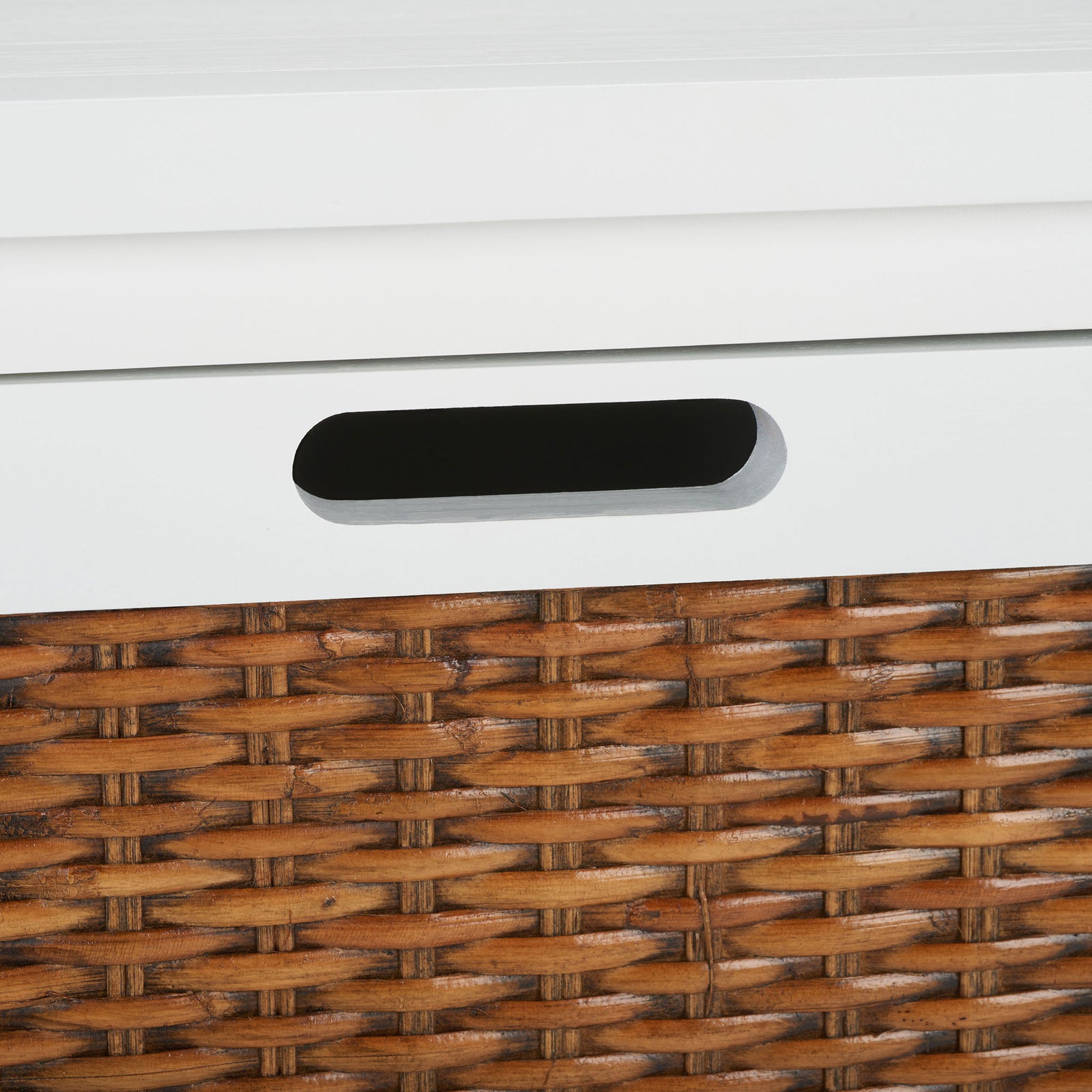 A rounded cutout pull offers a discreet grip above the honey-brown woven inset || AMH6531D || handle_studio