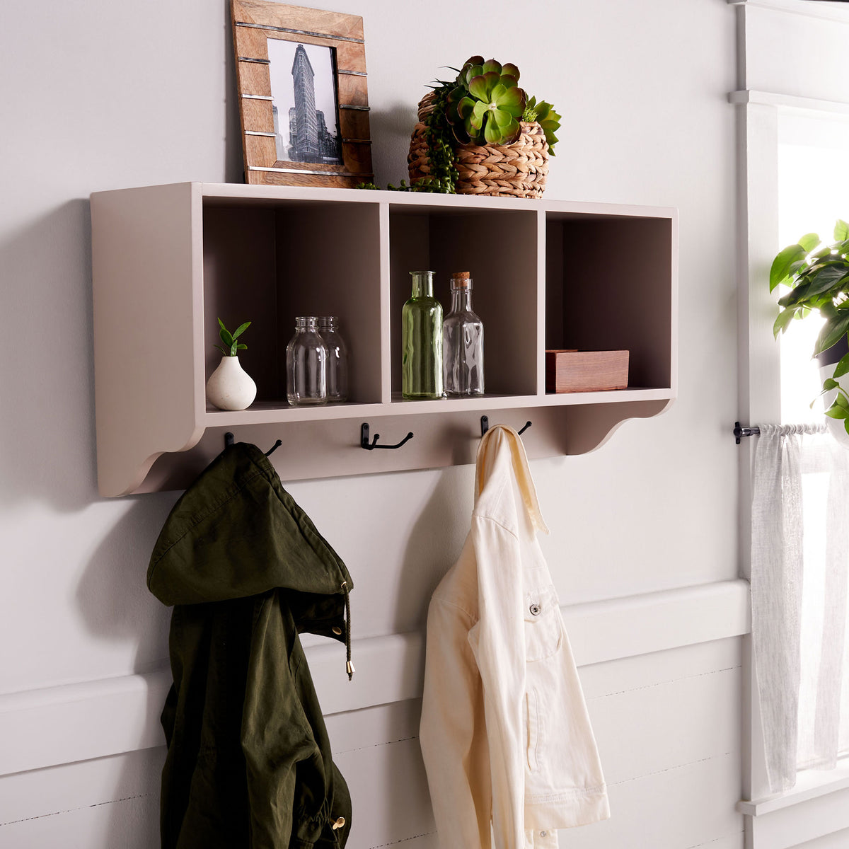 Gray wall cubbies display bottles and decor while hooks keep jackets close at hand || AMH6566C || front_angle_room