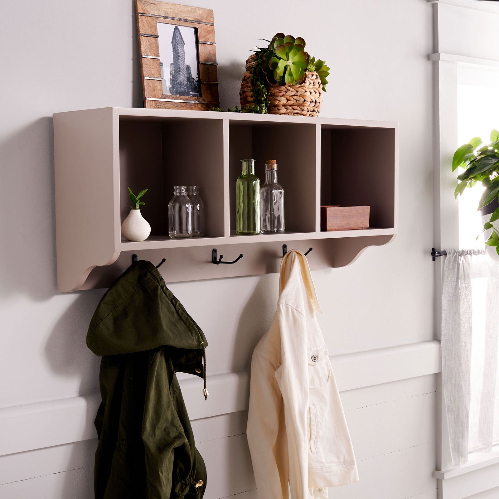 Gray wall cubbies display bottles and decor while hooks keep jackets close at hand || AMH6566C || front_angle_room