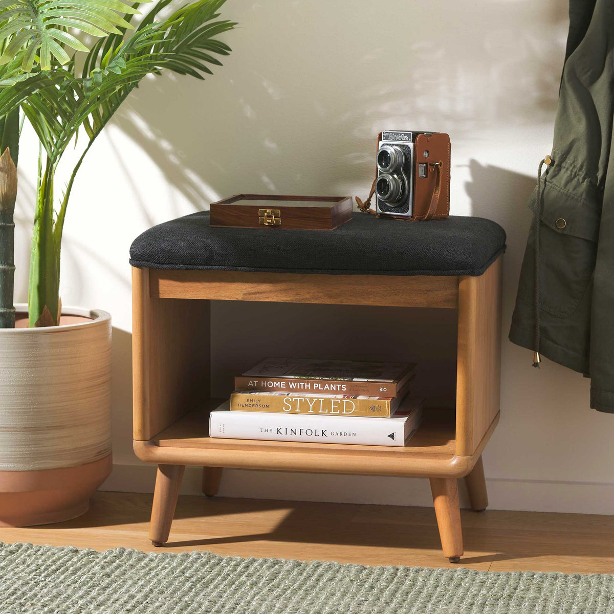 Entryway-ready bench adds seating and storage with its black cushion and open shelf || BCH5001A || front_angle_room