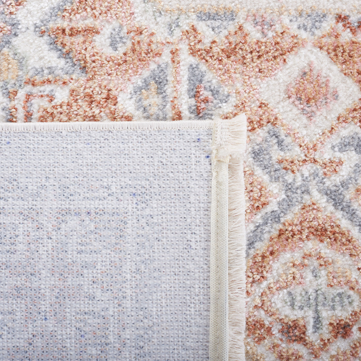 Rug front and underside display a sturdy woven backing and neatly bound edges. || BLR202B-5 || backing_studio