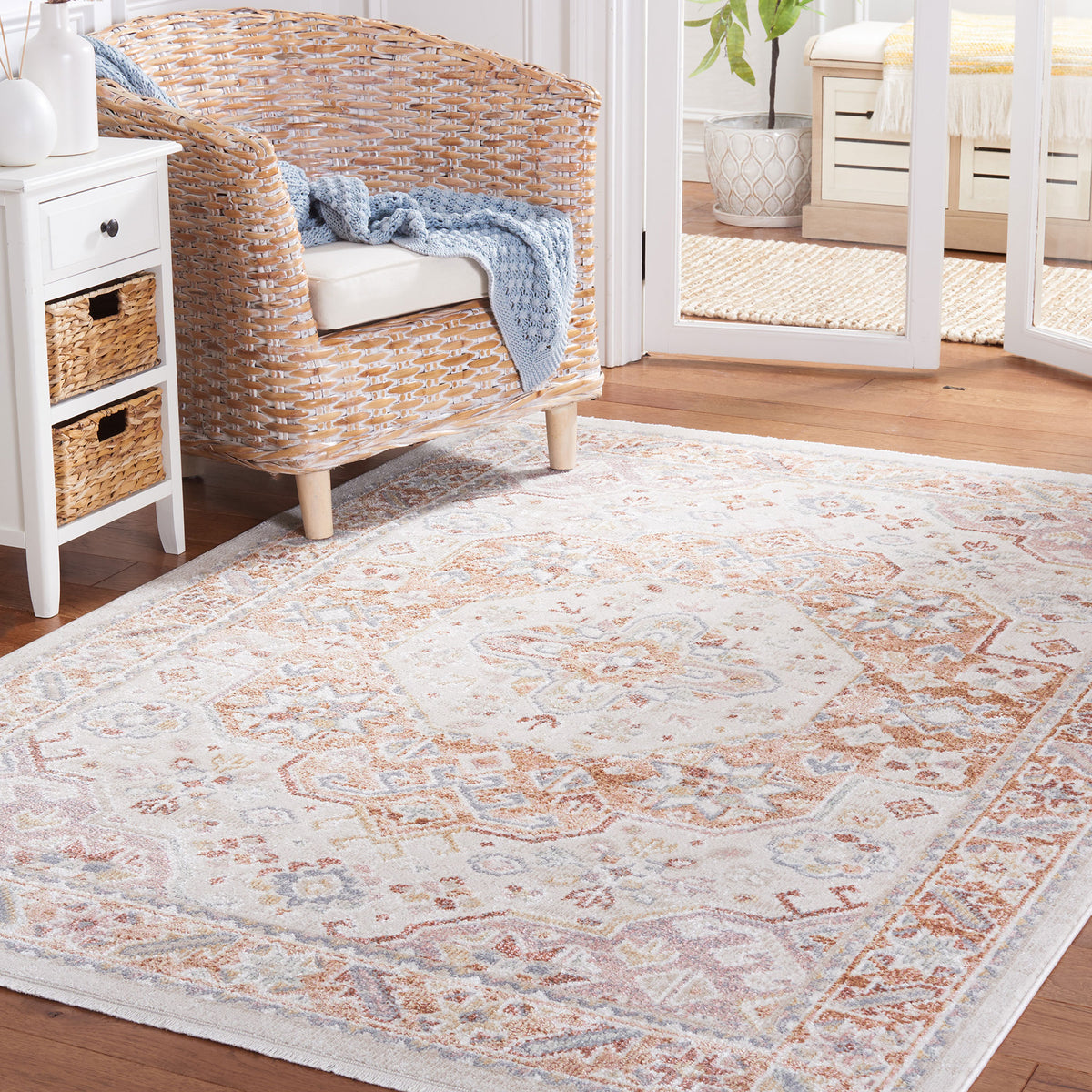 Beige and rust medallion rug adds warm, inviting style to a bright living space. || BLR202B-5 || front_angle_room