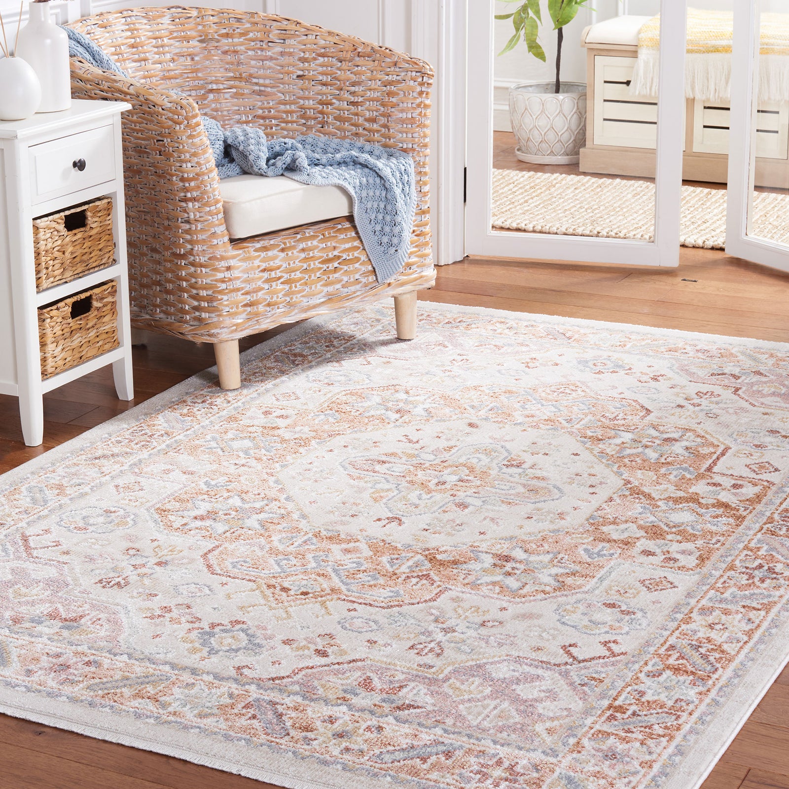 Beige and rust medallion rug adds warm, inviting style to a bright living space. || BLR202B-5 || front_angle_room