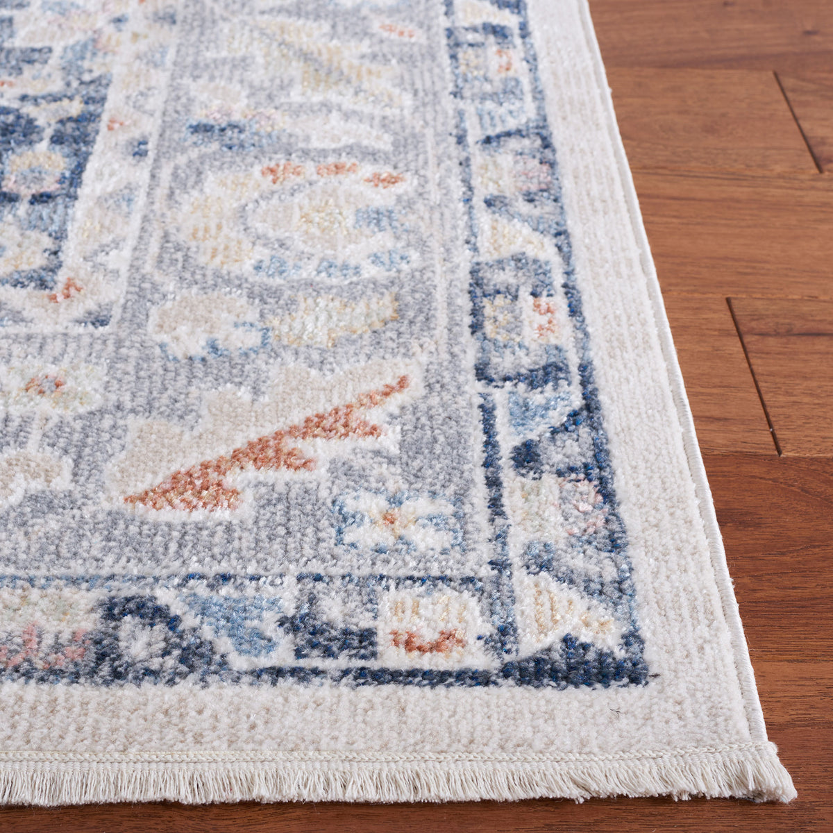 Crisp serged edge and ornate border in layered blue, gray, and beige tones || BLR204B-5 || corner_room