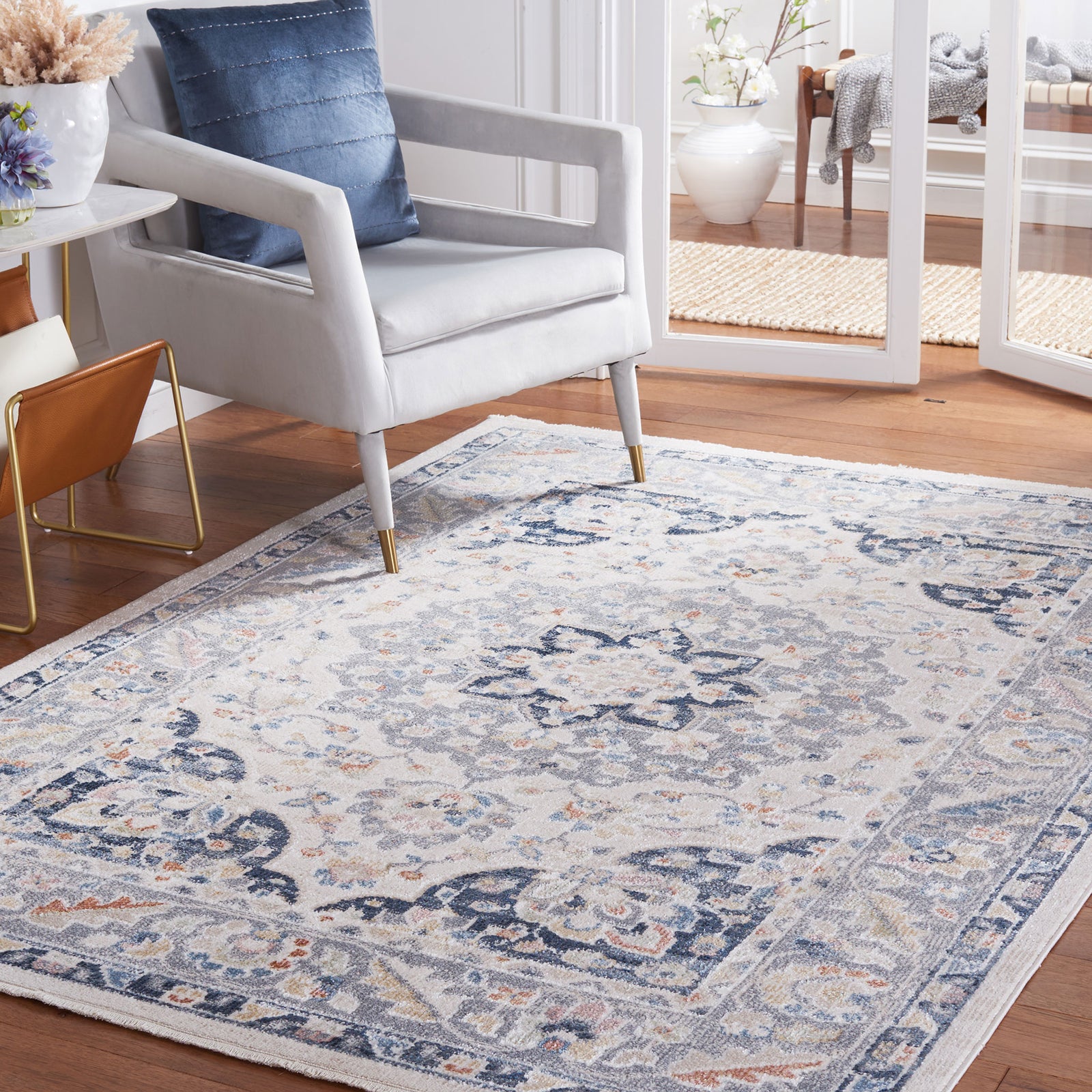 Vintage-style beige and navy rug warms the room with a soft, easy-care feel and classic medallion pattern || BLR204B-5 || front_angle_room