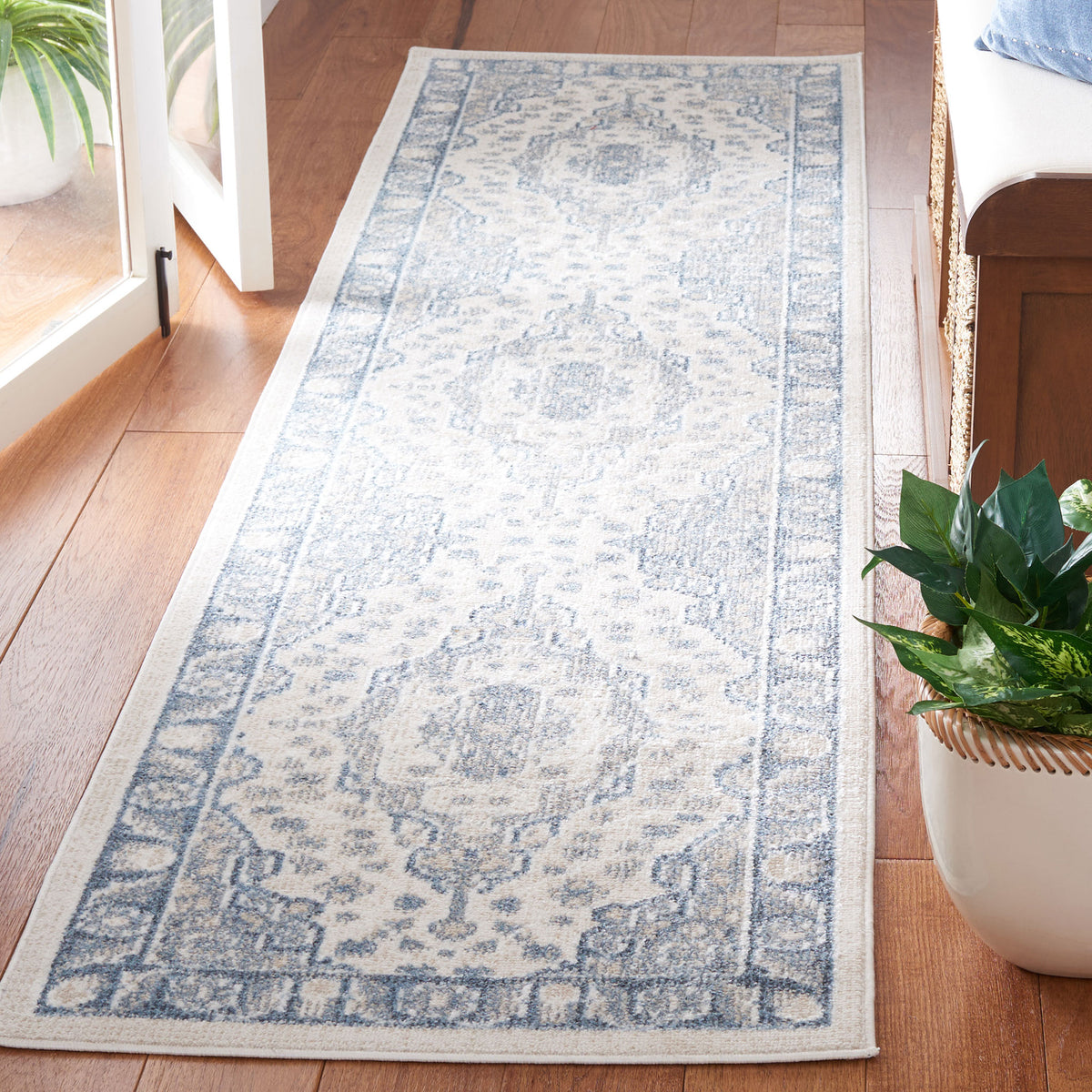 Distressed beige and blue medallion runner with ornate border and a slim profile || BLR208B-28 || front_angle_room
