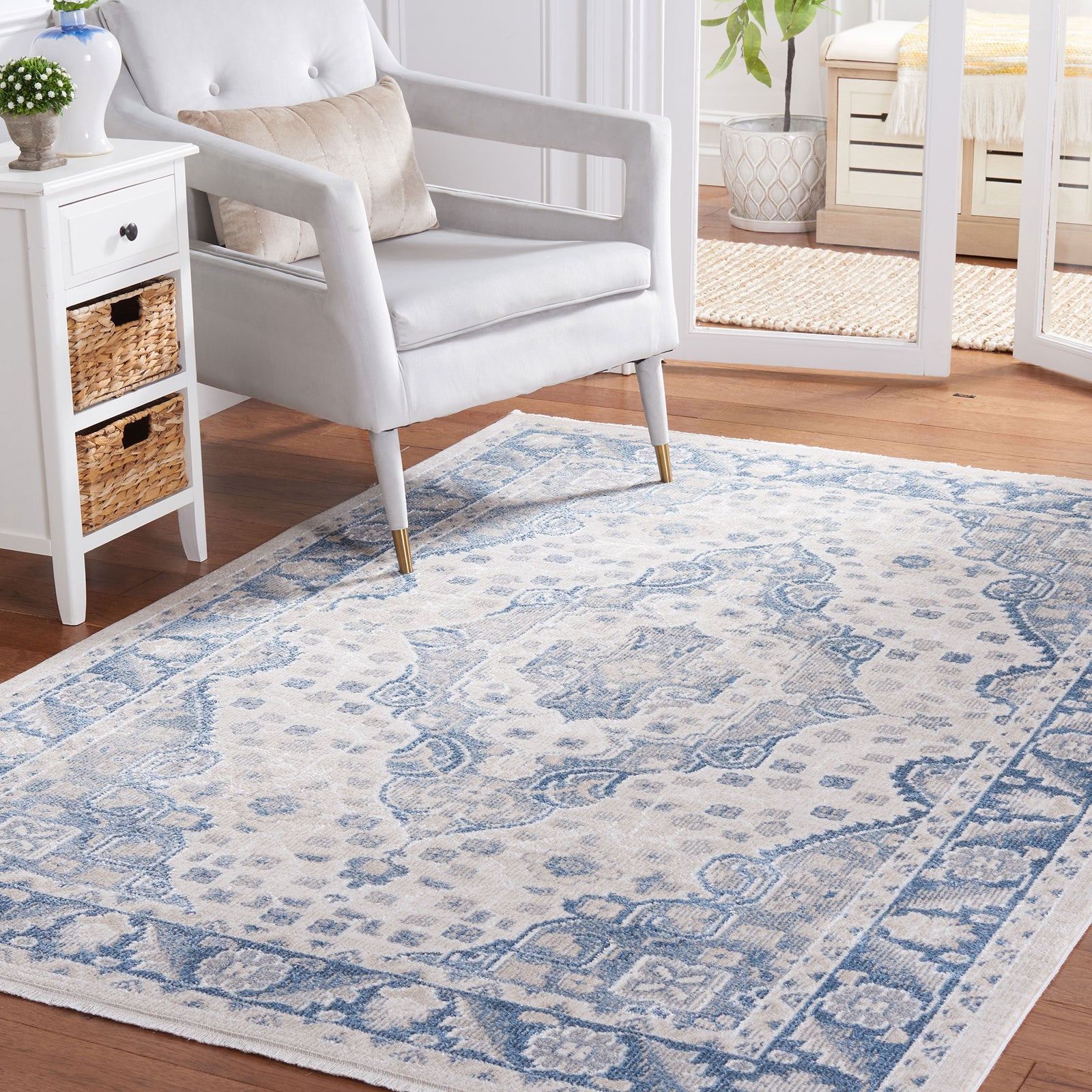 Beige and blue area rug anchors the space with a classic medallion and floral border pattern || BLR208B-5 || front_angle_room