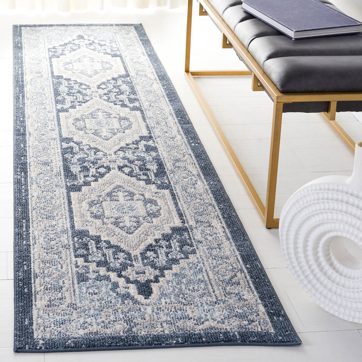 Vintage-style beige and navy runner rug with medallion motifs and a gently faded finish. || BLR210B-28 || top_angle_room