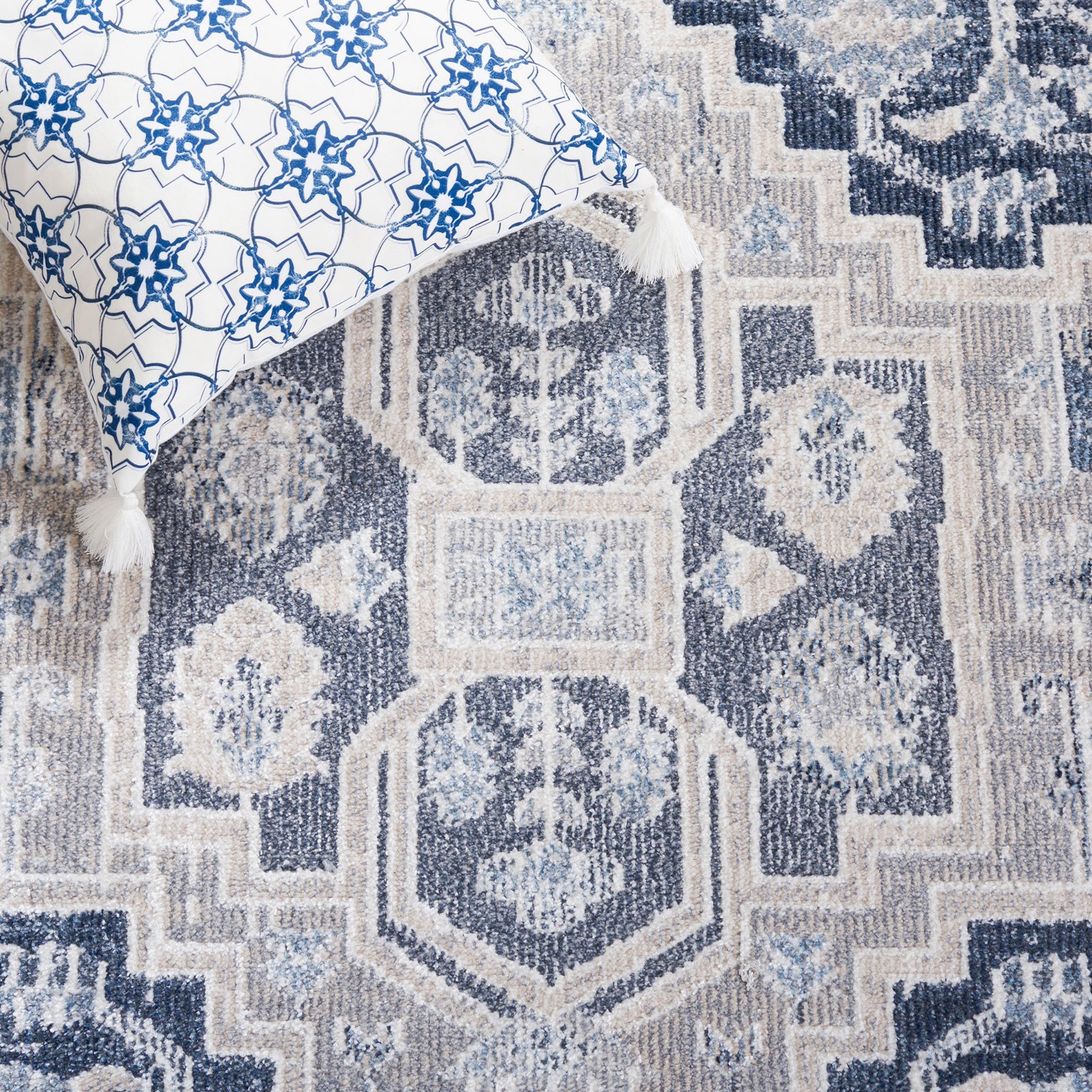 Intricate central medallion and layered motifs bring depth in navy and beige tones || BLR210B-5 || detail_room
