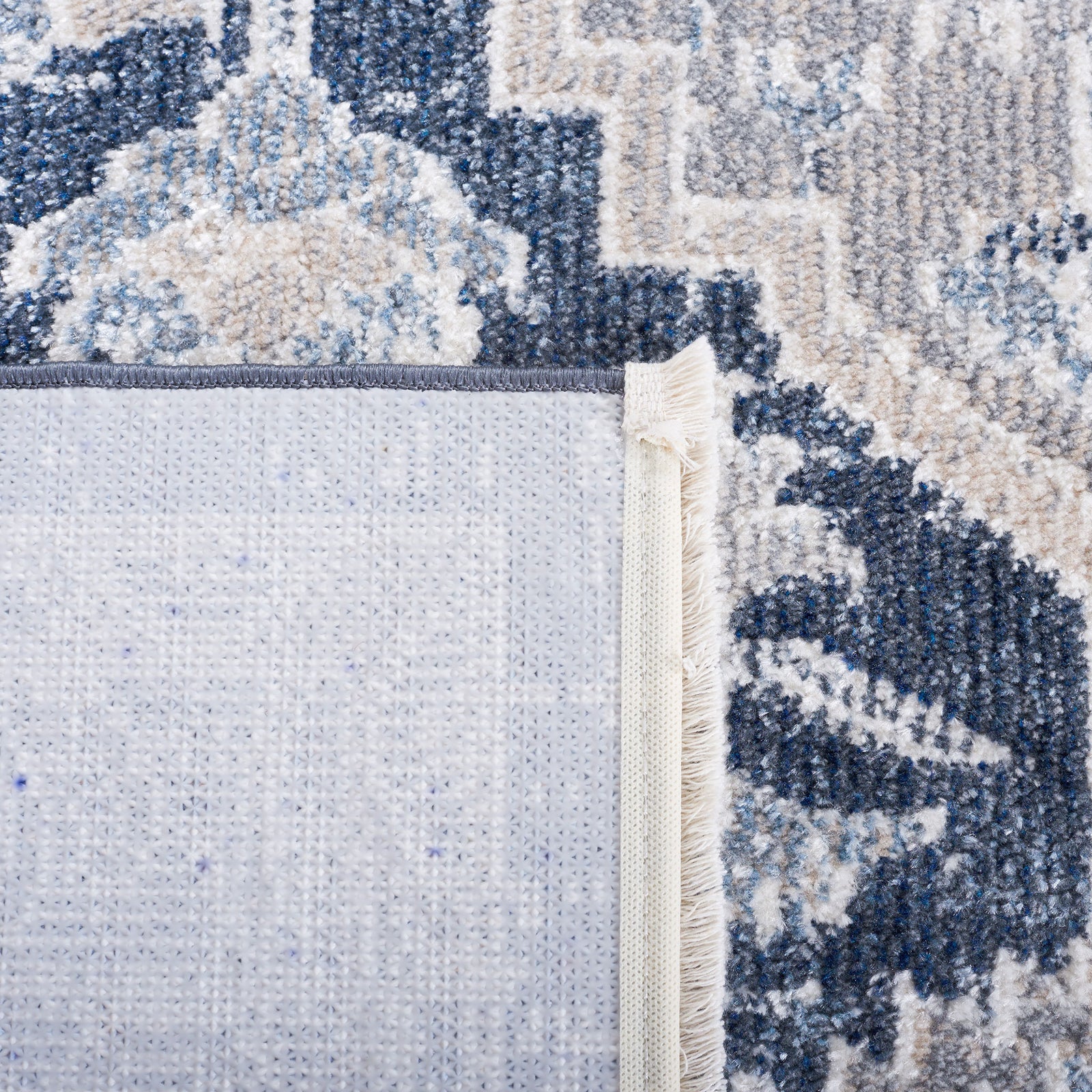 Textured backing and reinforced edge tape highlight the rug's quality build || BLR210B-5 || backing_studio