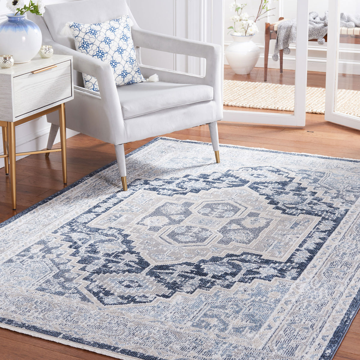 Ornate geometric medallion framed by intricate border in tonal beige and navy with subtle fade || BLR210B-5 || top_room