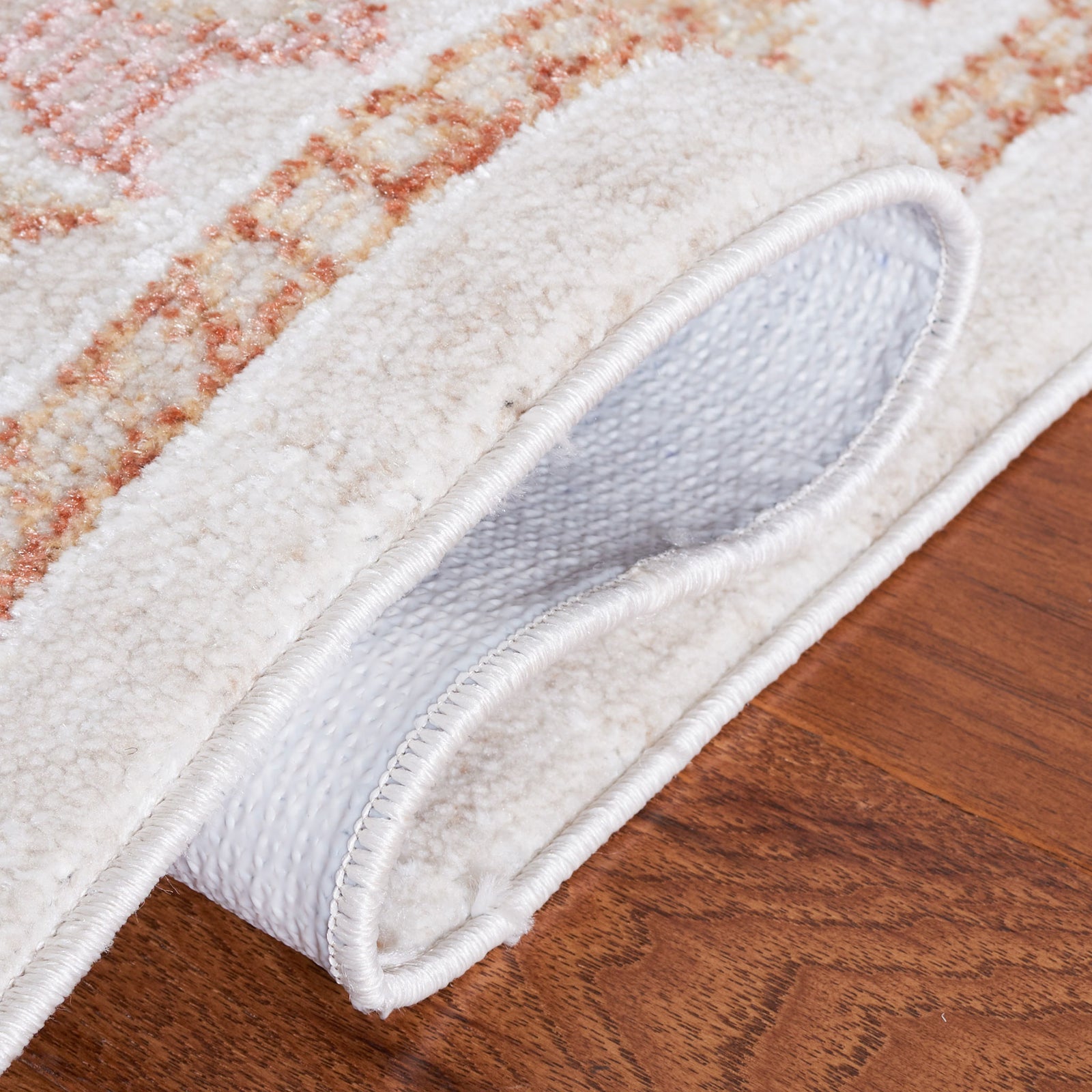 Folded edge reveals durable woven backing and cushioned, low-profile pile || BLR214B-5 || backing_room