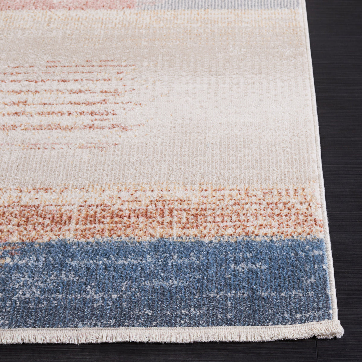 Neatly wrapped corner showcases the soft pile and blended beige, rust, and blue patterning || BLR216B-5 || corner_room