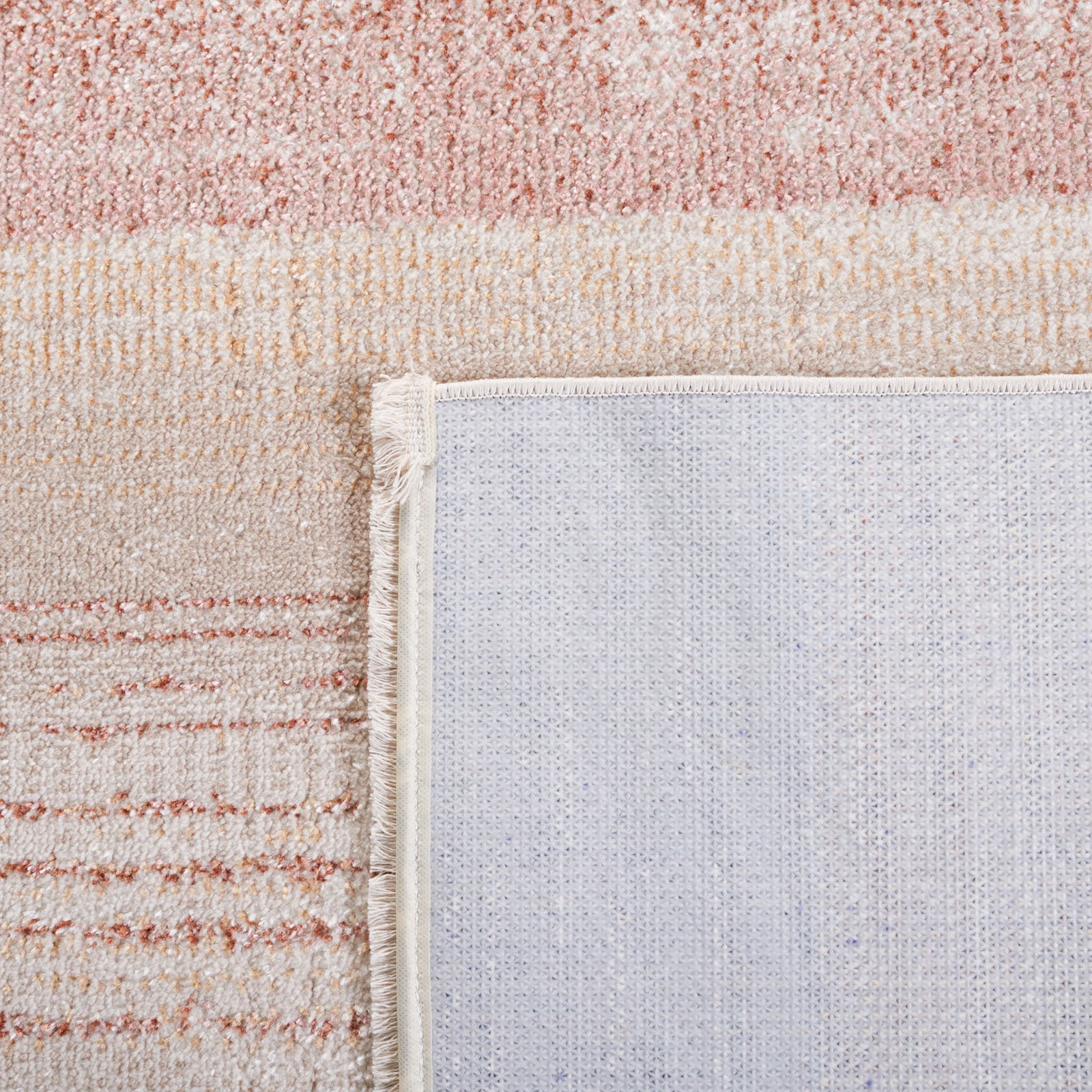 Corner flipped to show the backing and tidy edge finish in soft beige, rust, and blue || BLR216B-5 || backing_room