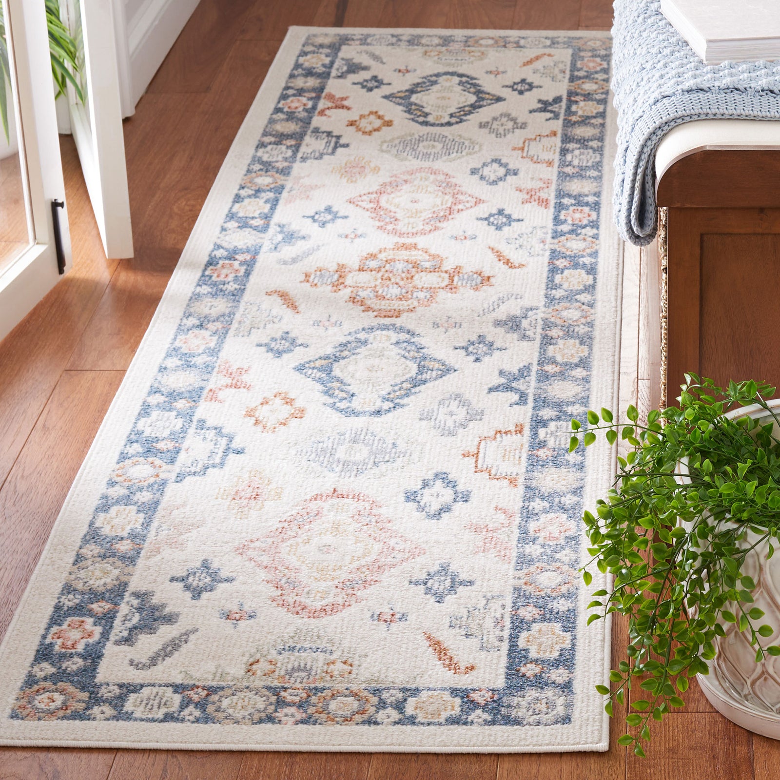 Versatile beige and blue runner with faded medallions and floral border, machine-washable for effortless upkeep || BLR218B-28 || top_angle_room
