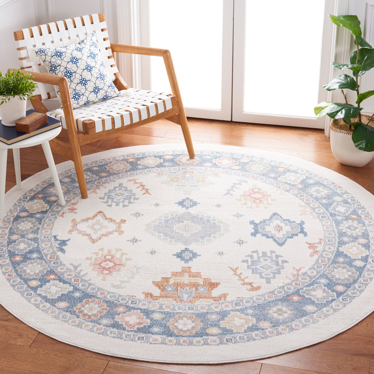 Round beige and blue rug anchors a cozy corner with a soft, low-pile vintage look. || BLR218B-7R || front_angle_room