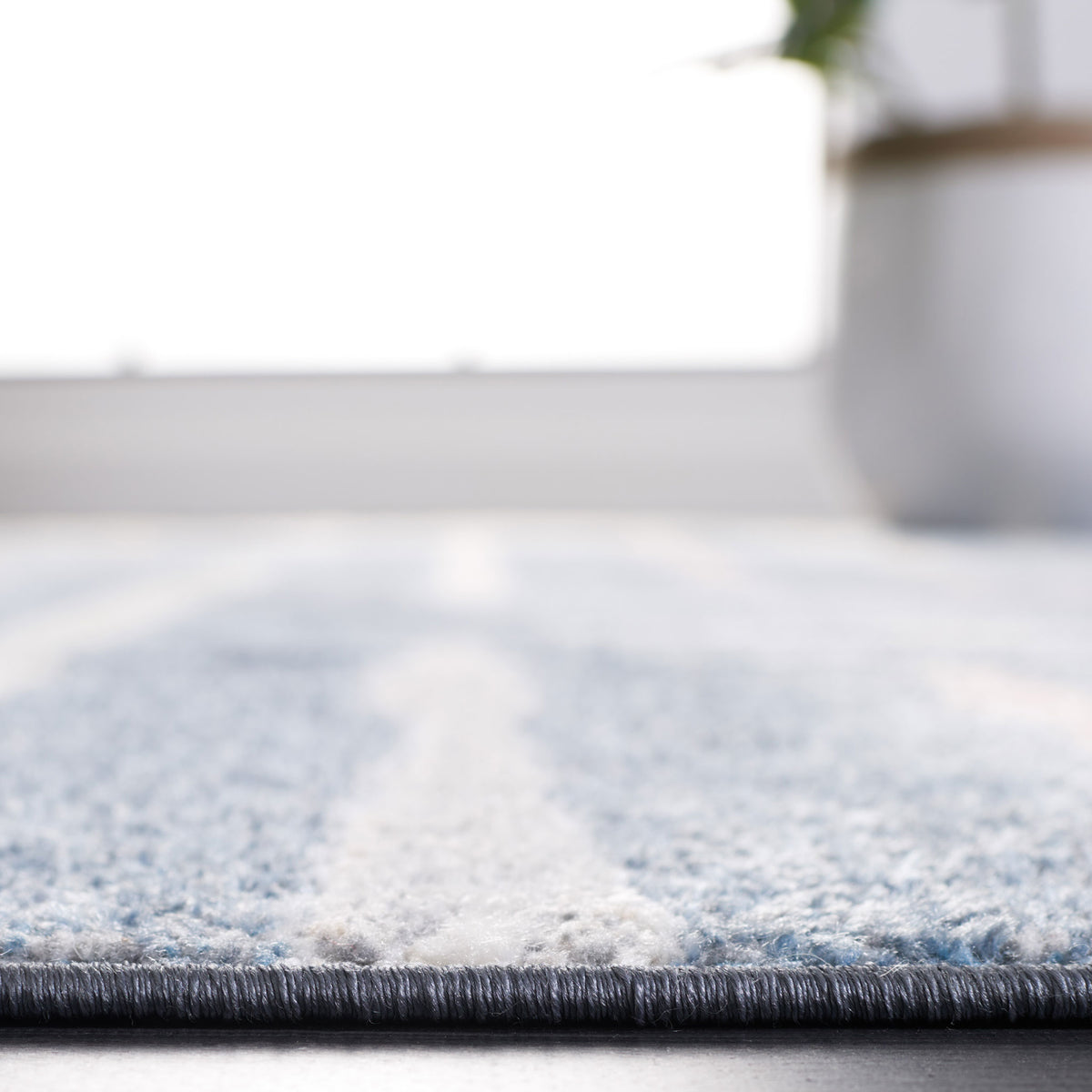 Plush blue rug showcasing soft pile height and a smoothly bound edge || BLR222M-5 || detail_room