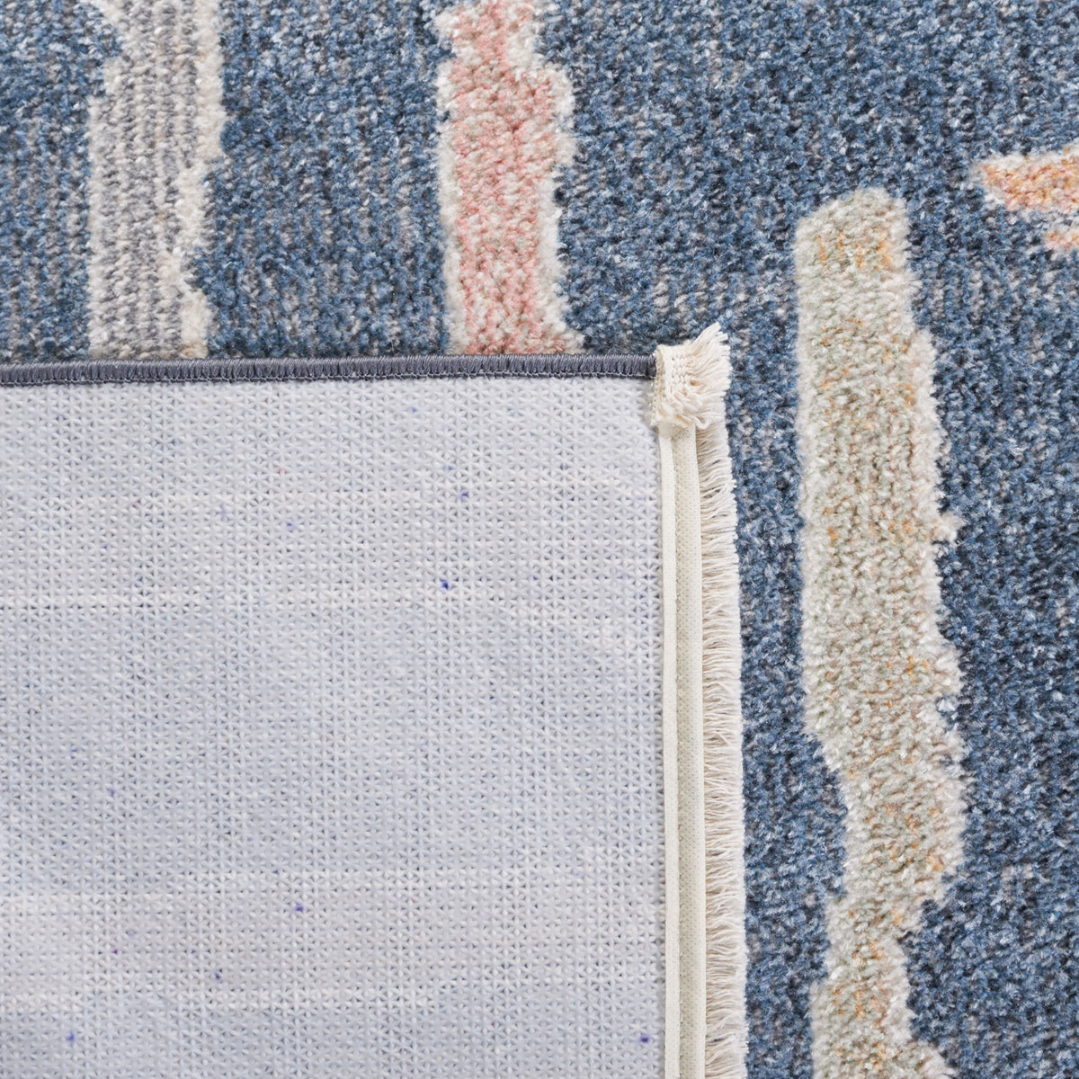 Corner flipped to show textured backing and multi-color linear stripe pattern || BLR222M-5 || backing_room