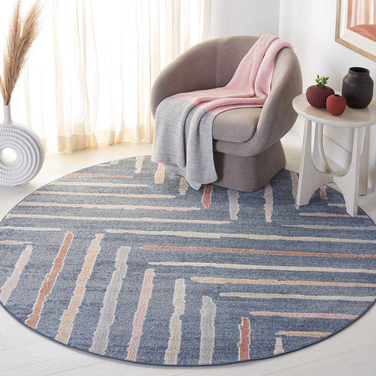 Modern round rug with a blue ground and playful raised stripes that add soft texture || BLR222M-7R || top_angle_room